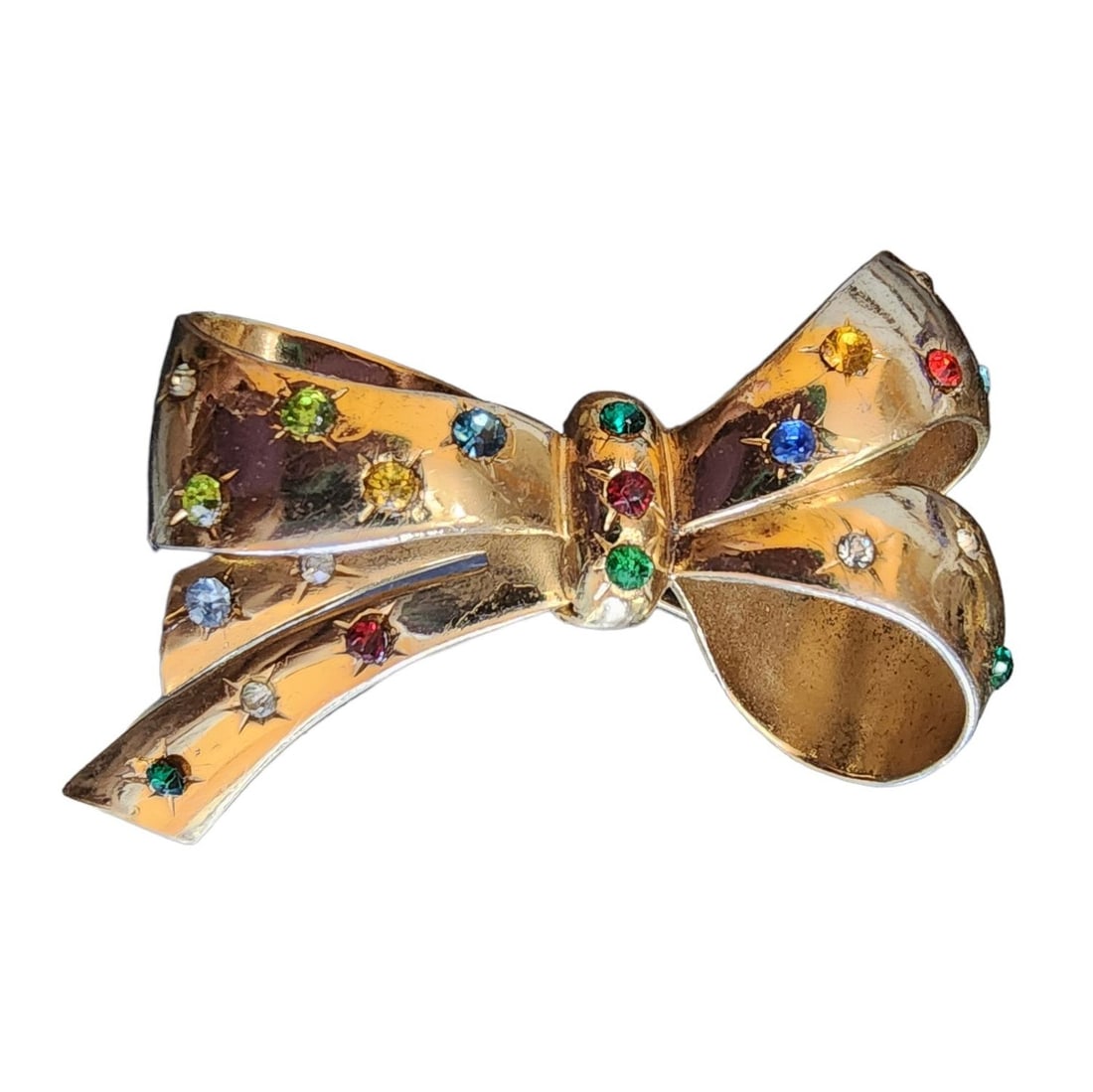 Vintage Signed Coro Rhinestone Bow Brooch: Vintage Signed Coro Rhinestone Bow Brooch (A1942) A fabulous vintage brooch signed by Coro features a beautiful bow design. It is accented with multicolor rhinestones, adding a touch of sparkle to the