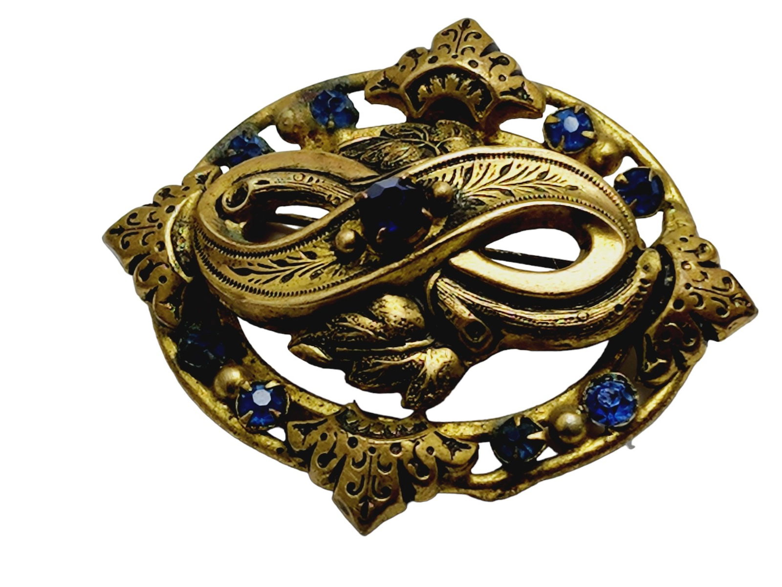 Vintage Victorian Revival Brooch (A852): Vintage Victorian Revival Brooch. Vintage 1940s Victorian Revival brooch with great detailing and blue rhinestone accents. Clasp is intact. Measurement: Approx. 2". Condition: Very good; some darkenin
