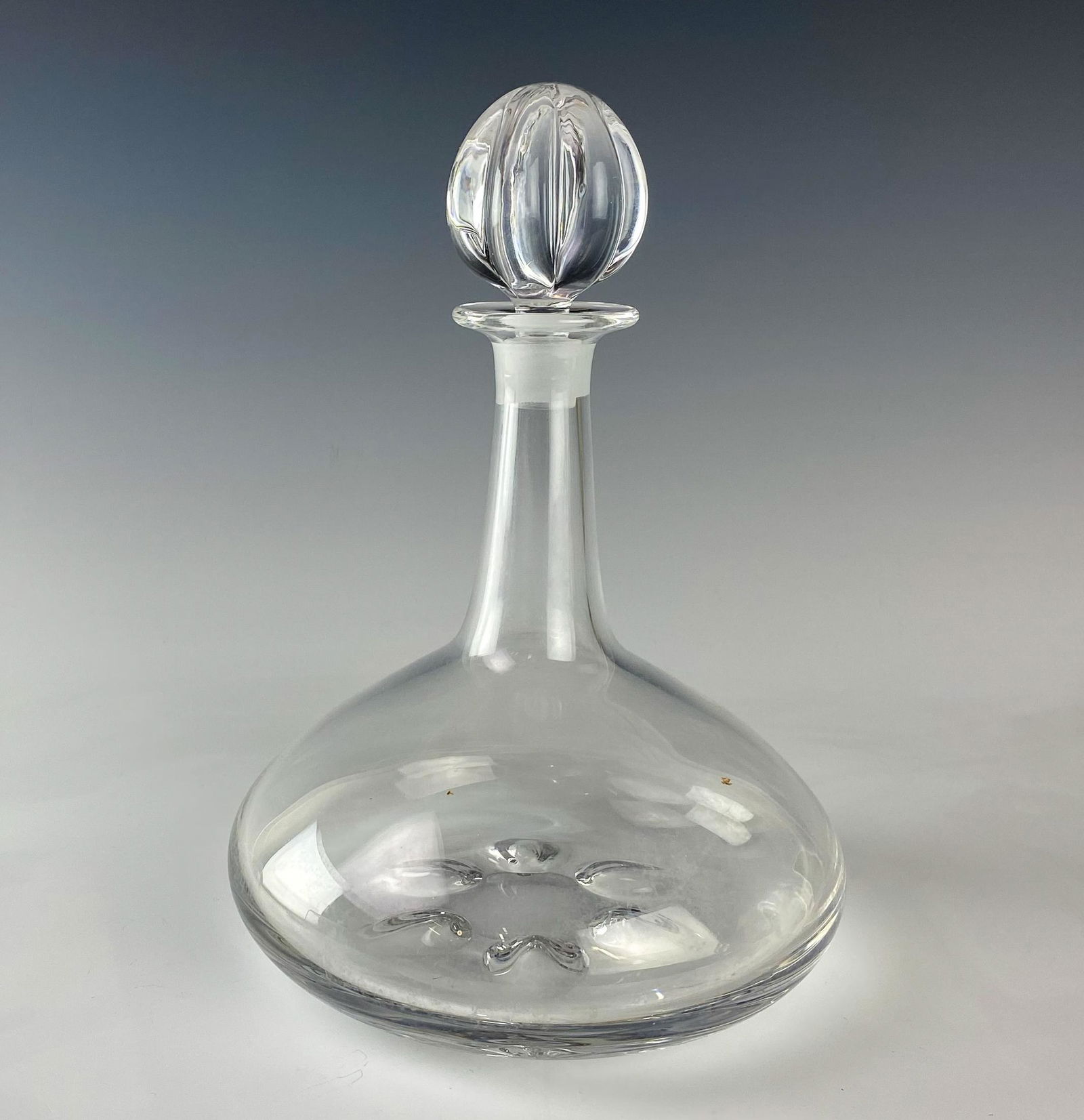 Orrefors Nils Landberg 11" Art Glass Ship Decanter: Orrefors (Swedish). Solid, heavy crystal decanter designed by Nils Landberg (Swedish, 1907-1991). Modeled with elongated neck over sloped body, underside with six concave leaf forms. Oval shaped glass