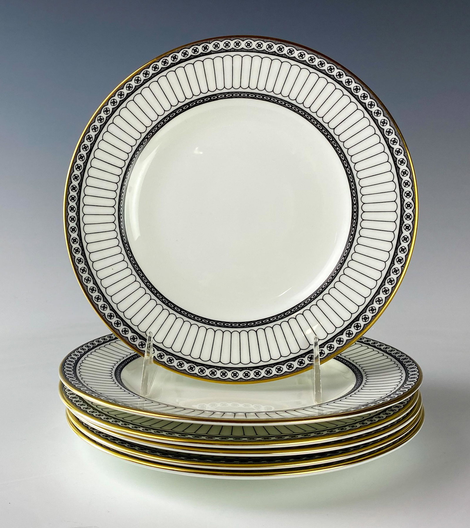 Wedgwood Bone China Colonnade Salad Plates SET 6: Wedgwood (English). Black geometric line design with circles around border, rim with a gold trim. Pattern introduced 1960, retired 2004. Warm glazed finish. Signed with black urn stamp WEDGWOOD BONE C