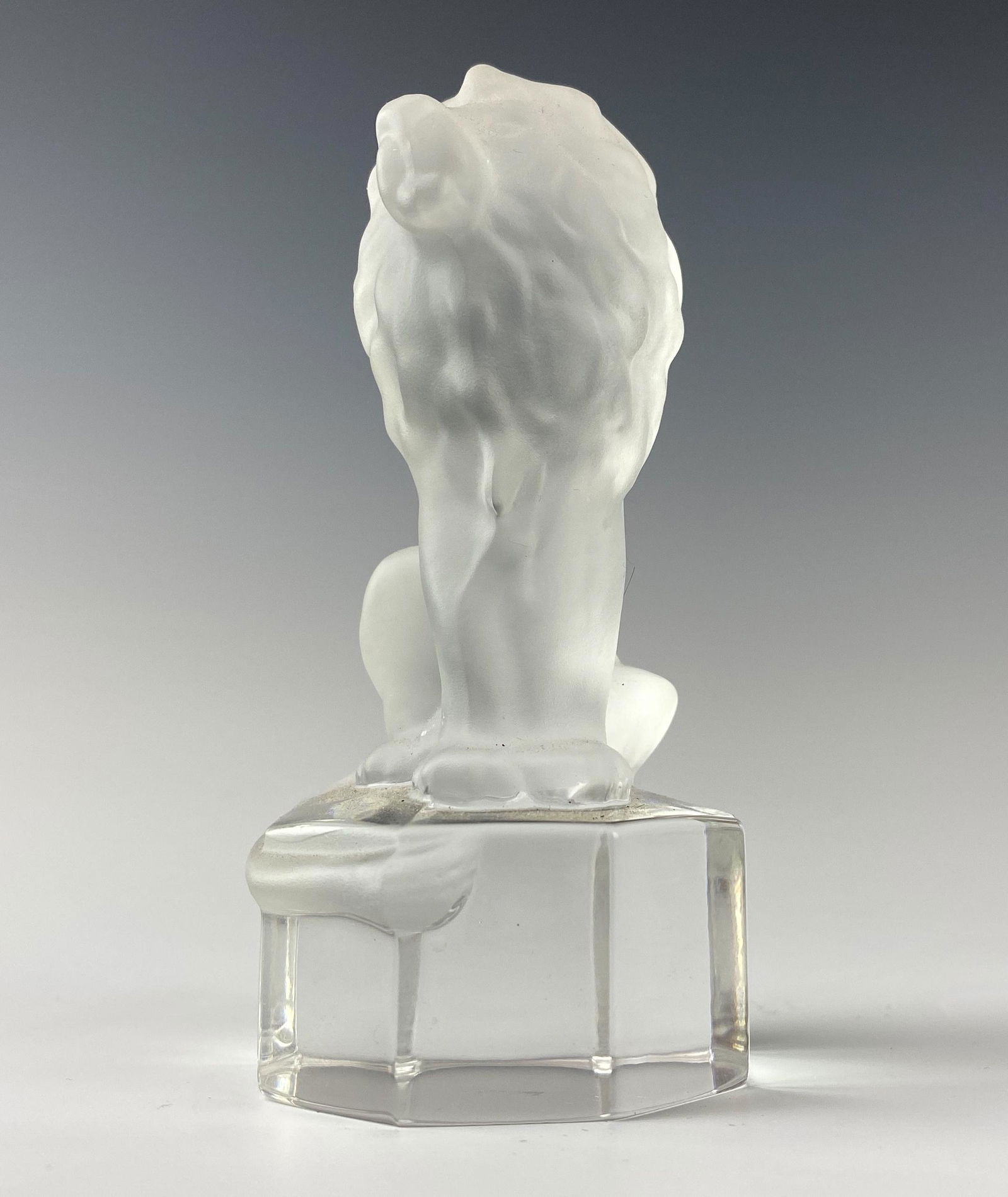 Goebel Frosted Crystal Lion Glass Desk Paperweight: Features the King of the Jungle in classic seated pose. Modeled in frosted crystal and set on an octagonal clear glass base. Signed GOEBEL. Good estate fresh condition. No chips, cracks or repairs. Me