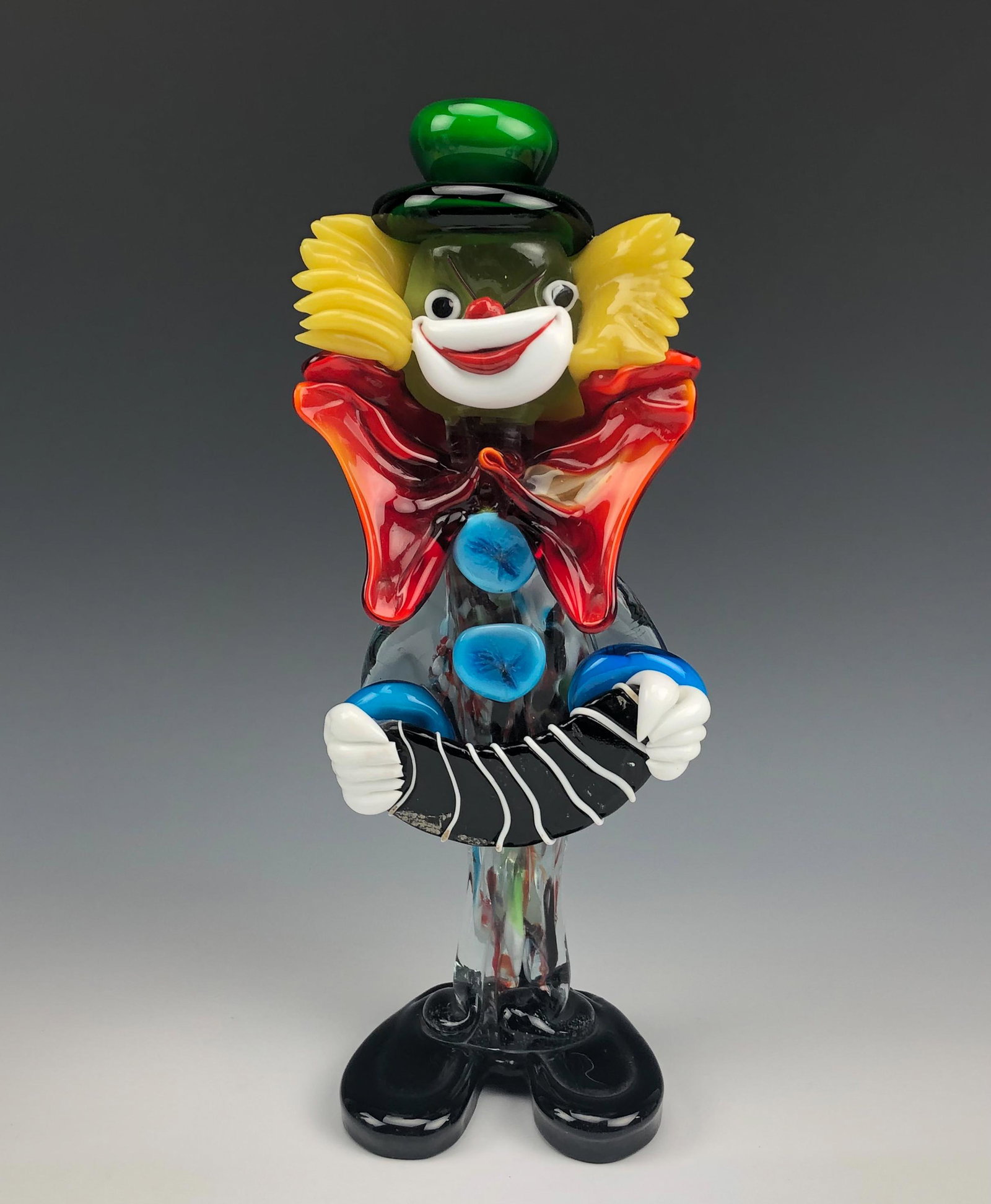 Murano Circus Clown Hand Blown Art Glass Figurine: LARGE Murano Italy studio hand blown Italian art glass circus carnival clown figurine. Circa 20th Century. Features happy smiley chap with exaggerated applied glass accents, and over sized shoes, play