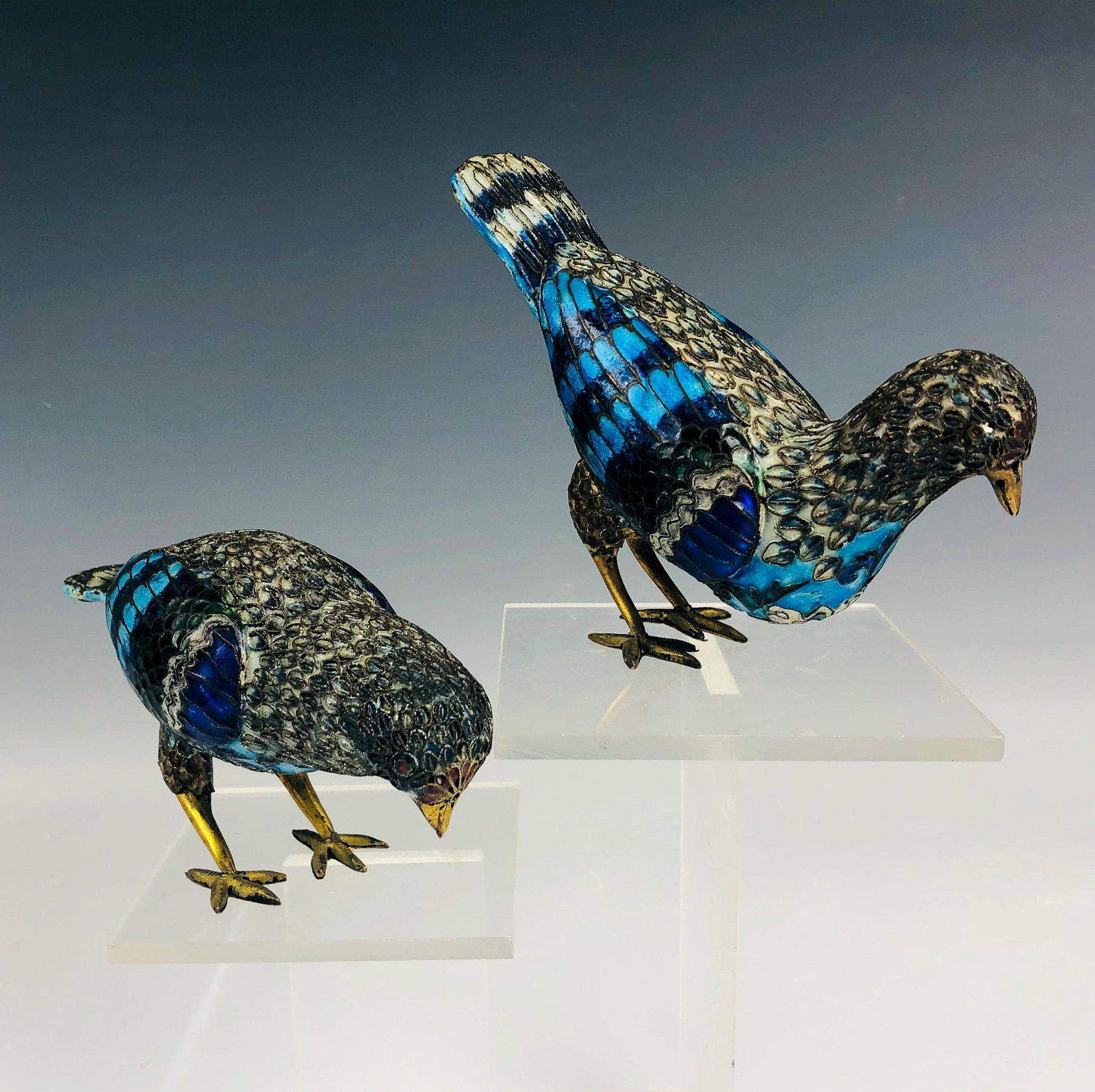 Pr Chinese Export Cloisonne Enamel Bird Figurines: Features a painstakingly well modeled pair of bird figures of Chinese cultural art. Both graced with enamel accents on a wired brass ground. Warm original aged patina. Unsigned. Good estate fresh cond
