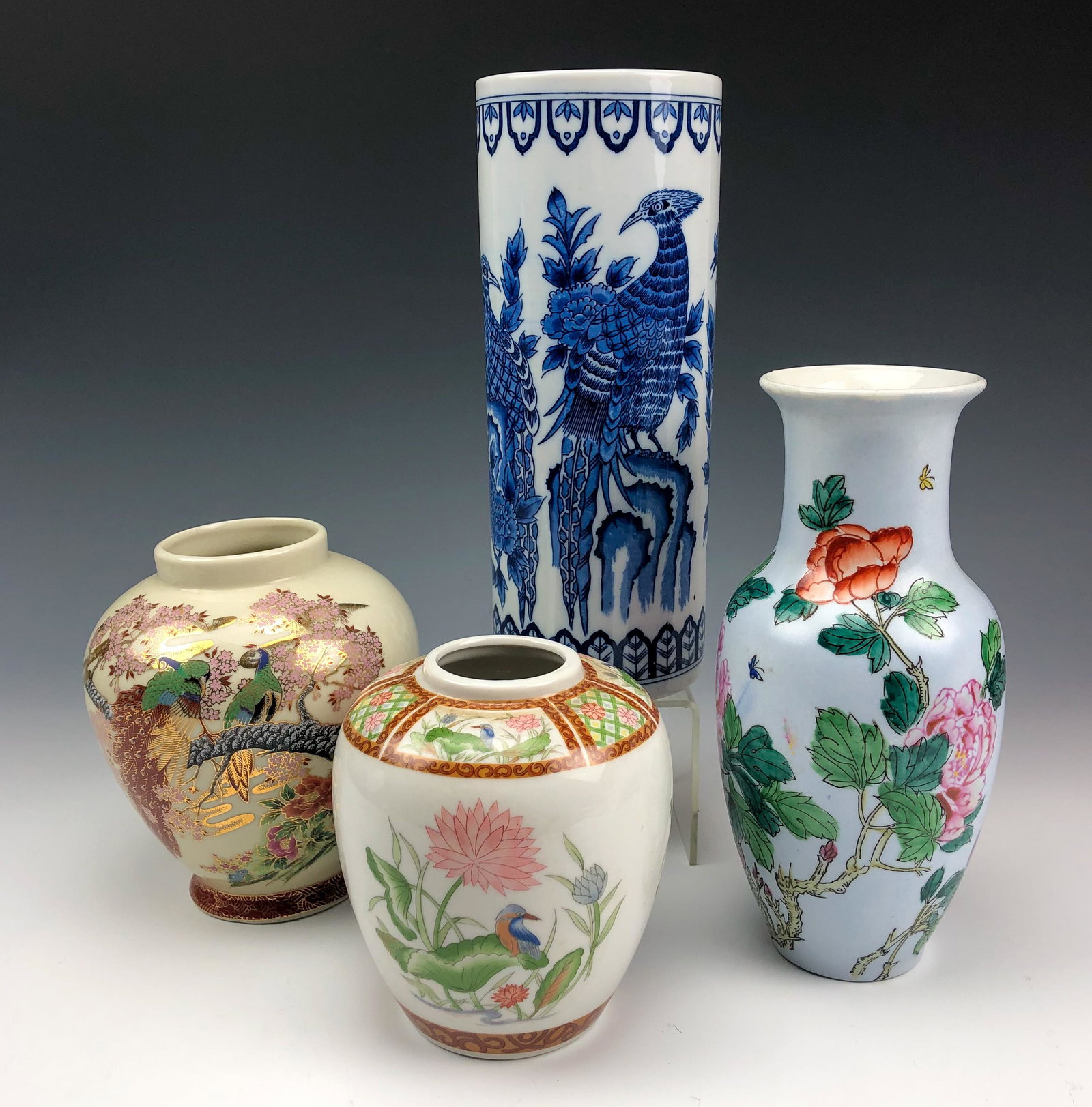 LOT 4 Chinese Japanese Porcelain Bird Flower Vases: Included are 4 Asian Hand Painted Porcelain Shelf Mantle Display Vases with bulbous and cylinder forms. All graced with nature inspired floral, insect and exotic bird decorations. Warm glazed finish t
