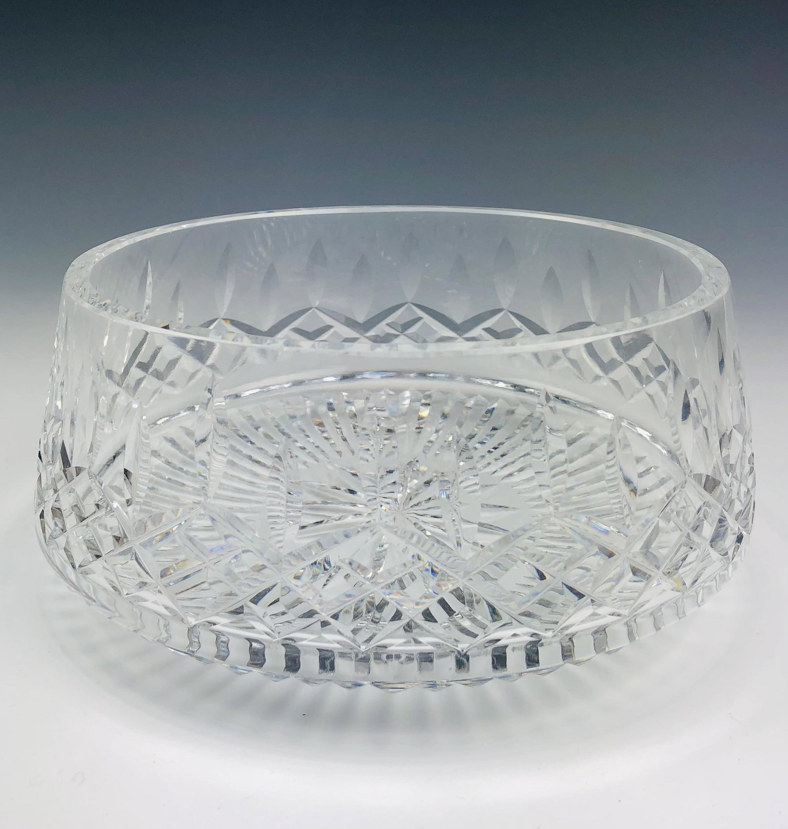 Waterford Cut Crystal "Lismore" Serving Centerbowl: Signed Waterford Cut Crystal Art Glass Centerpiece Serving Bowl. Pattern Lismore introduced in 1957. Graced with vertical cuts over a diamond quilted body. 16 point star burst on the underside encased
