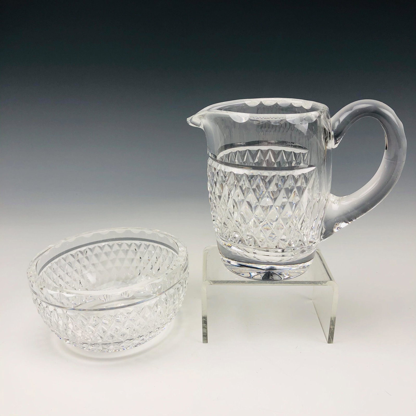Waterford Crystal Cashel Milk Creamer & Sugar Bowl: Signed Waterford Crystal Art Glass Milk Creamer Jug and Round Open Sugar Bowl. Modeled in the Cashel pattern that was introduced in 2002. Discontinued / retired in 2009. Bodies graced with a diamond q
