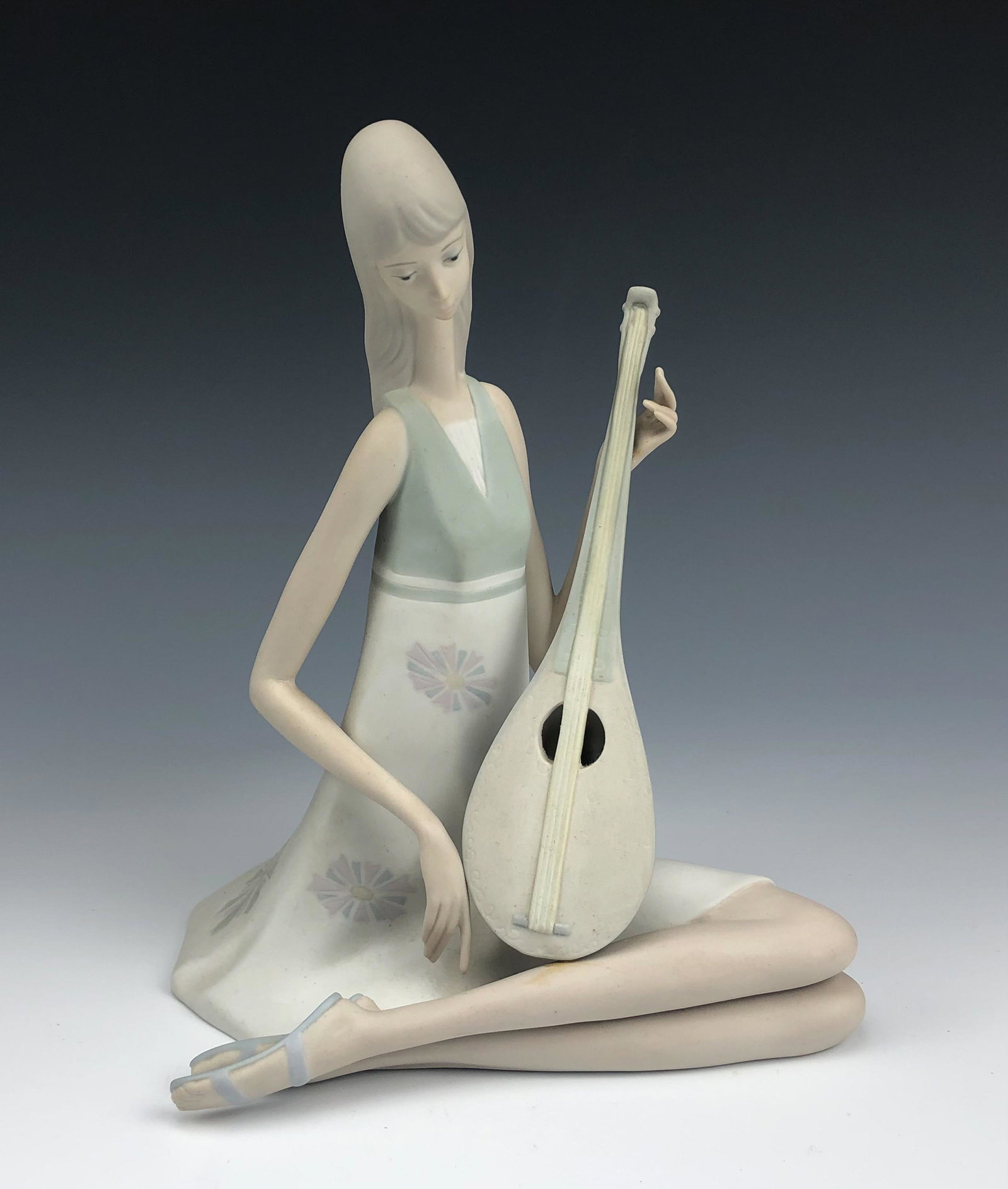 Lladro Girl w/ Mandolin # 1026 Porcelain Figurine: Retired Lladro Spain Hand Painted Signed Porcelain Figurine. Titled : Girl with Mandolin. Model number 1026. Designer : Julio Fernandez. Introduced in 1970. Discontinued / Retired in 1986. Finish : Ma