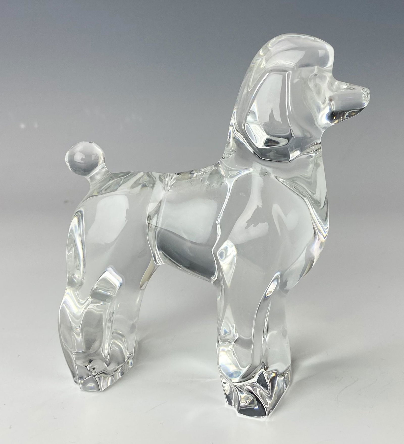 Baccarat French Crystal Poodle Glass Dog Figurine: Baccarat France Studio Hand Blown Art Glass Poodle K9 Dog Figurine. Exceptionally well modeled with an abstracted simplified form and depicted in attentive standing pose. Sparkling clear clarity. No b