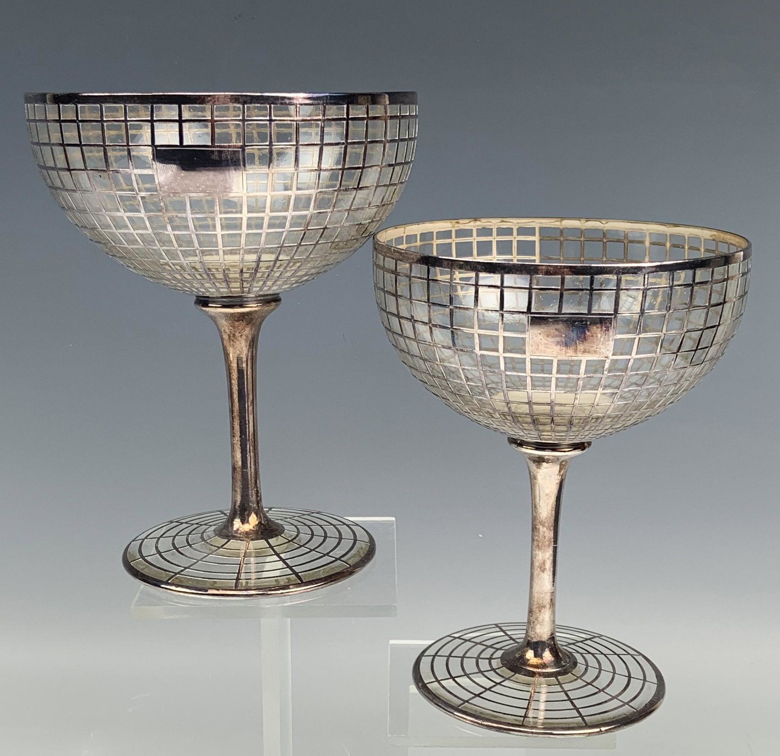 Art Deco Oversized Sterling Silver Overlay Goblets: Generously large and oversized glass goblets with a graduated sterling silver geometric pattern to the bowl. Applied sterling tapered stem over spreading circular base with a sterling silver spider we