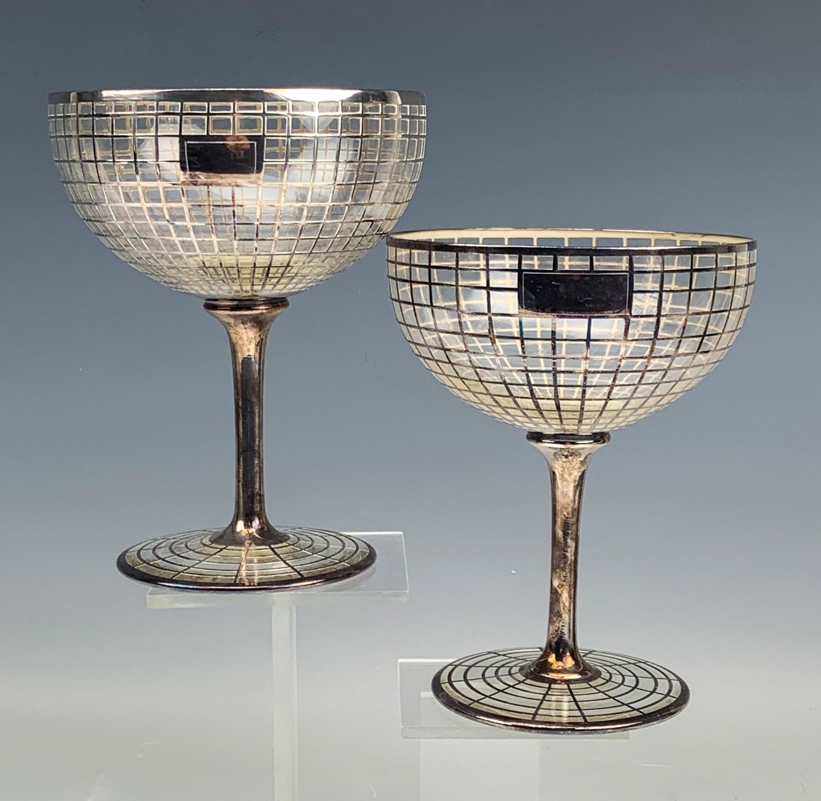 Art Deco Oversized Sterling Silver Overlay Goblets: Generously large and oversized glass goblets with a graduated sterling silver geometric pattern to the bowl. Applied sterling tapered stem over spreading circular base with a sterling silver spider we