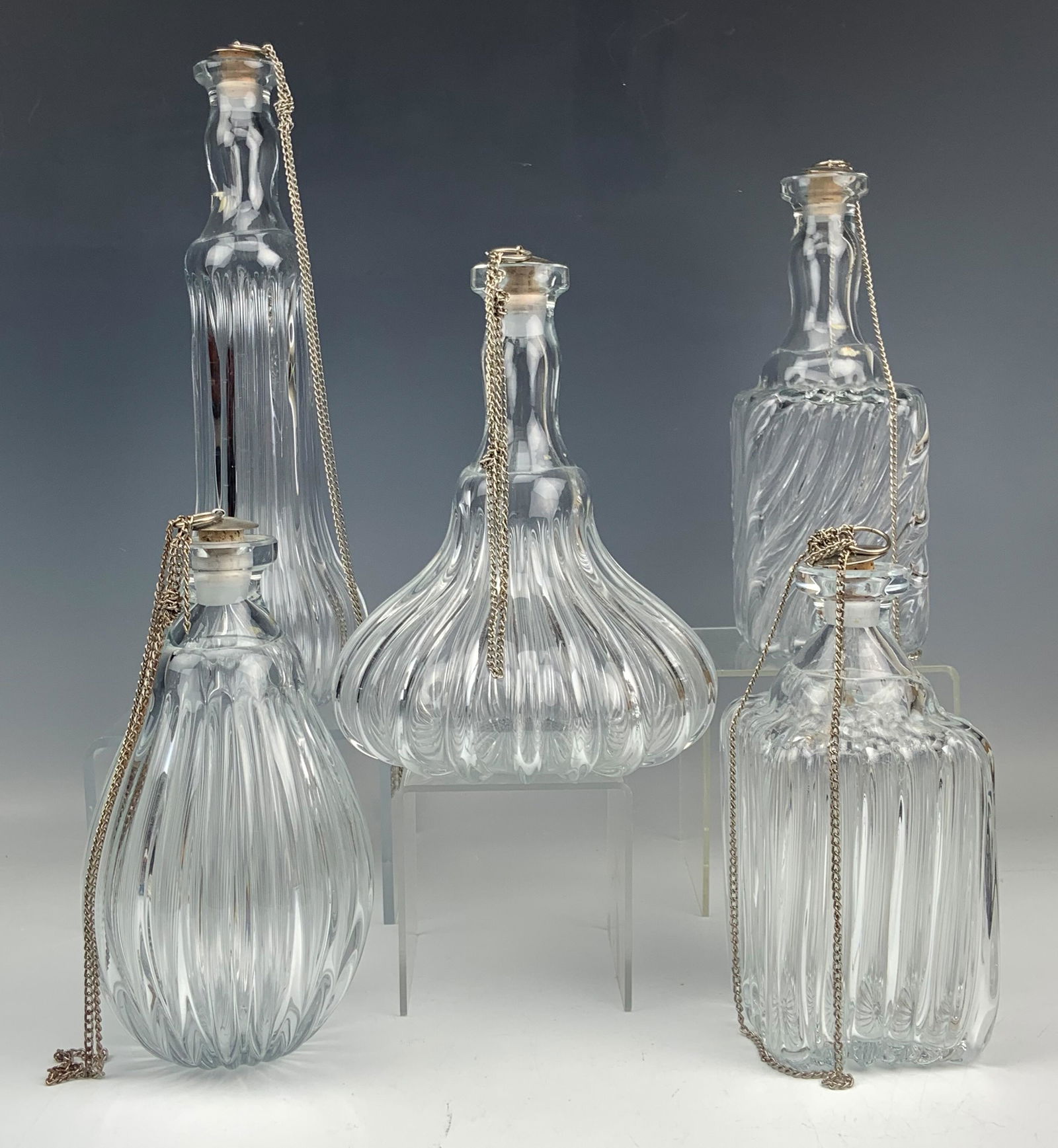 5 Ribbed Mold Blown Bar Barware Glass Decanters: Each distinctively well modeled with twenty ribs traversing the body, around. All with a clear appearance and nicely steeped in elegance, ideal for entertaining and serving. Glass stoppers with silver