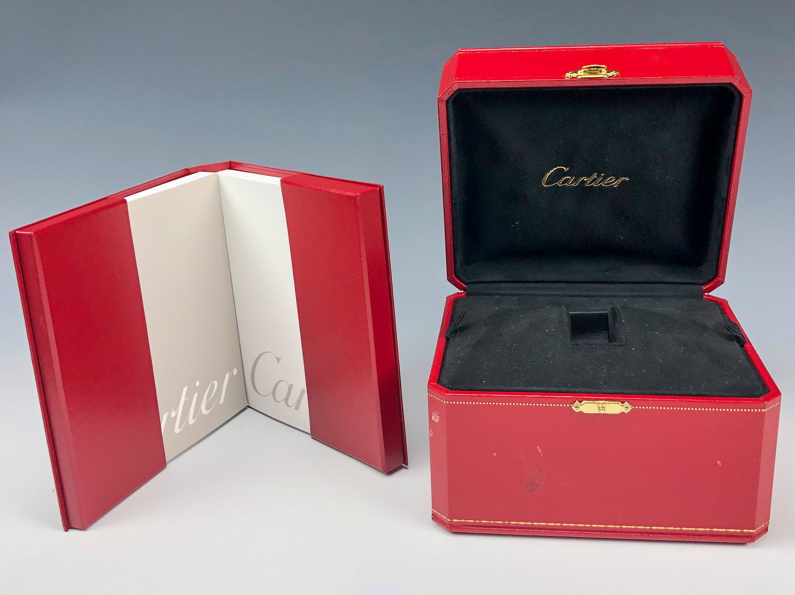 Cartier Watch Presentation Box & Manual Booklets: Genuine Factory CARTIER Red Leather Gold Trim Presentation Watch Box. Comes with 2 booklets housed in a red leather hard case Cartier folder. One booklet is grey with several languages and one white m
