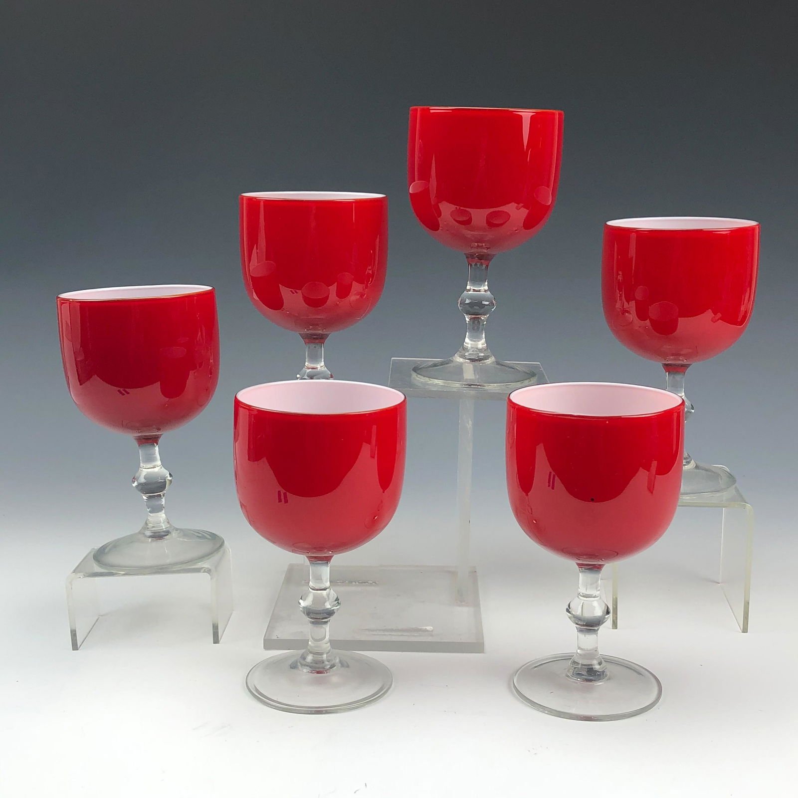 6 Carlo Moretti Mid Century Art Glass Wine Goblets: Established in 1958 in Murano, Venice by brothers Carlo & Giovanni Moretti. Painstakingly mouth blown in manner. Intense blood red exterior masterfully accented by a crisp white cased interior. Clear