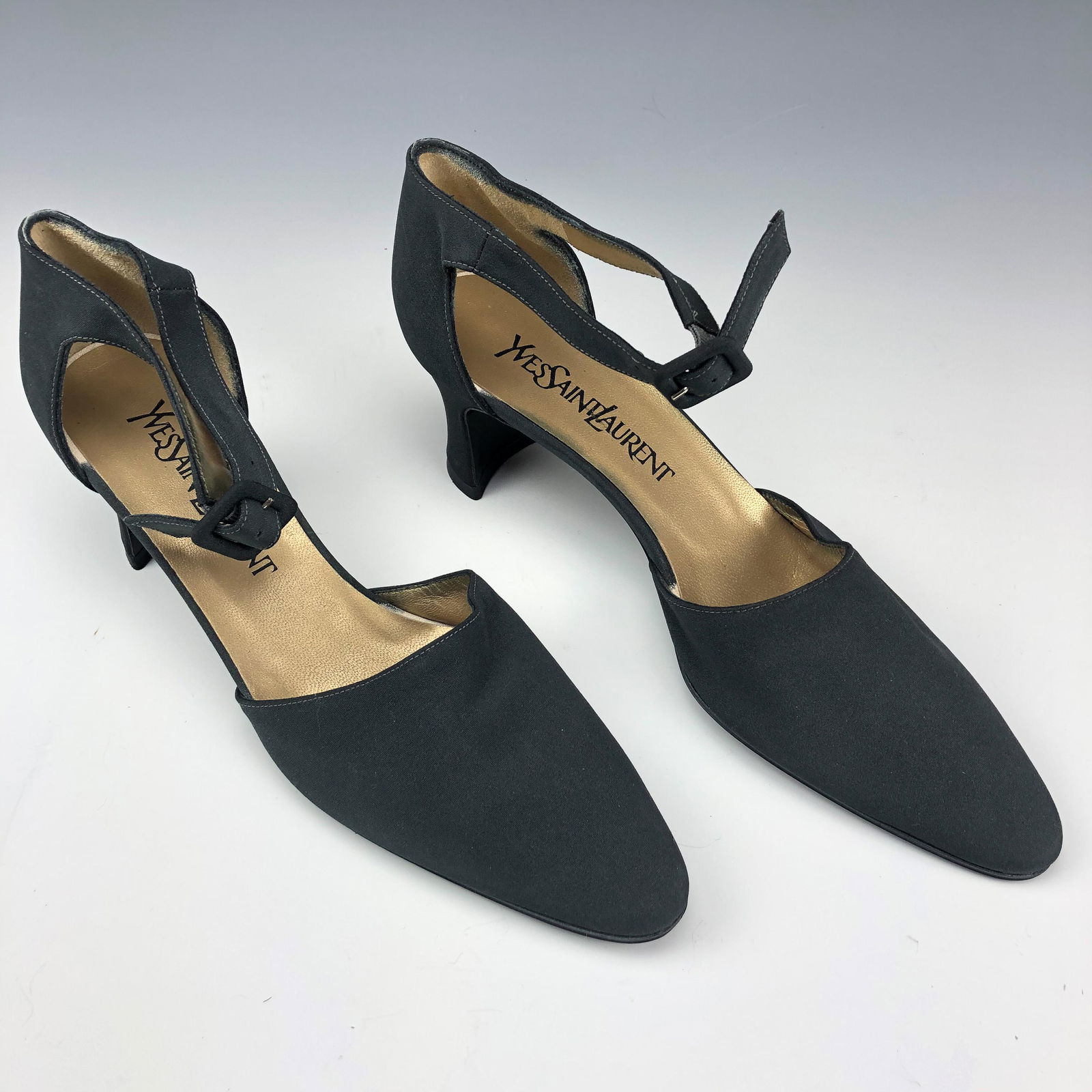 Yves St Laurent YSL Designer Kitten Heel Pump Sz 8: Satin lined leather ankle wrap low pumps from Yves St Laurent. Pointed like toe with slightly curved heel. Preowned. NO Box. Good estate fresh condition. Size 8. Heel measures approximately 2 1/8 in.