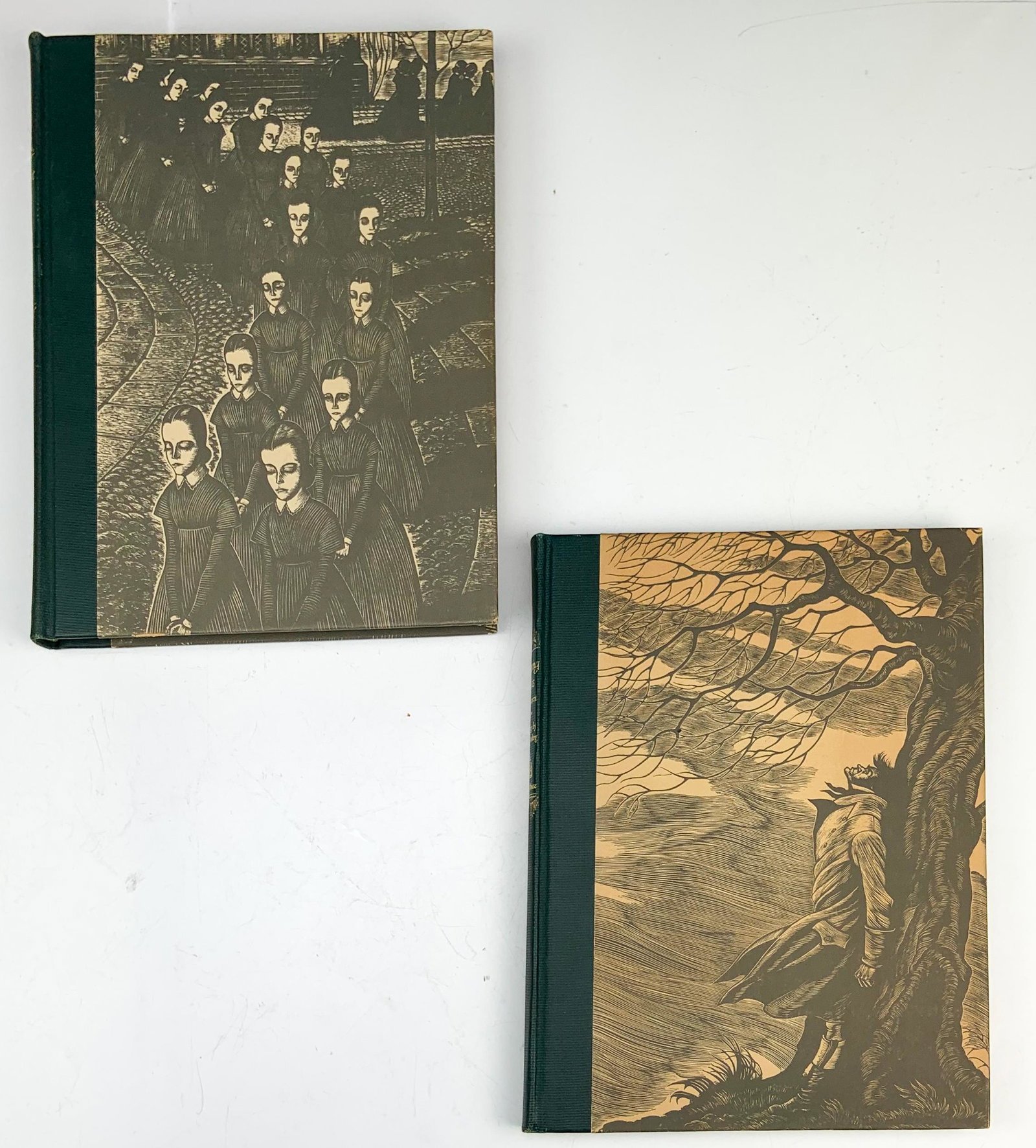 Jane Eyre & Wuthering Heights 2 Volume Book Set: Single Volume Two Novel Book Set published by Random House, New York, in 1943. Hardcover binding to both. Illustrated with wood engravings by Fritz Eichenberg. Signed on the first page Jim Slayman. Go