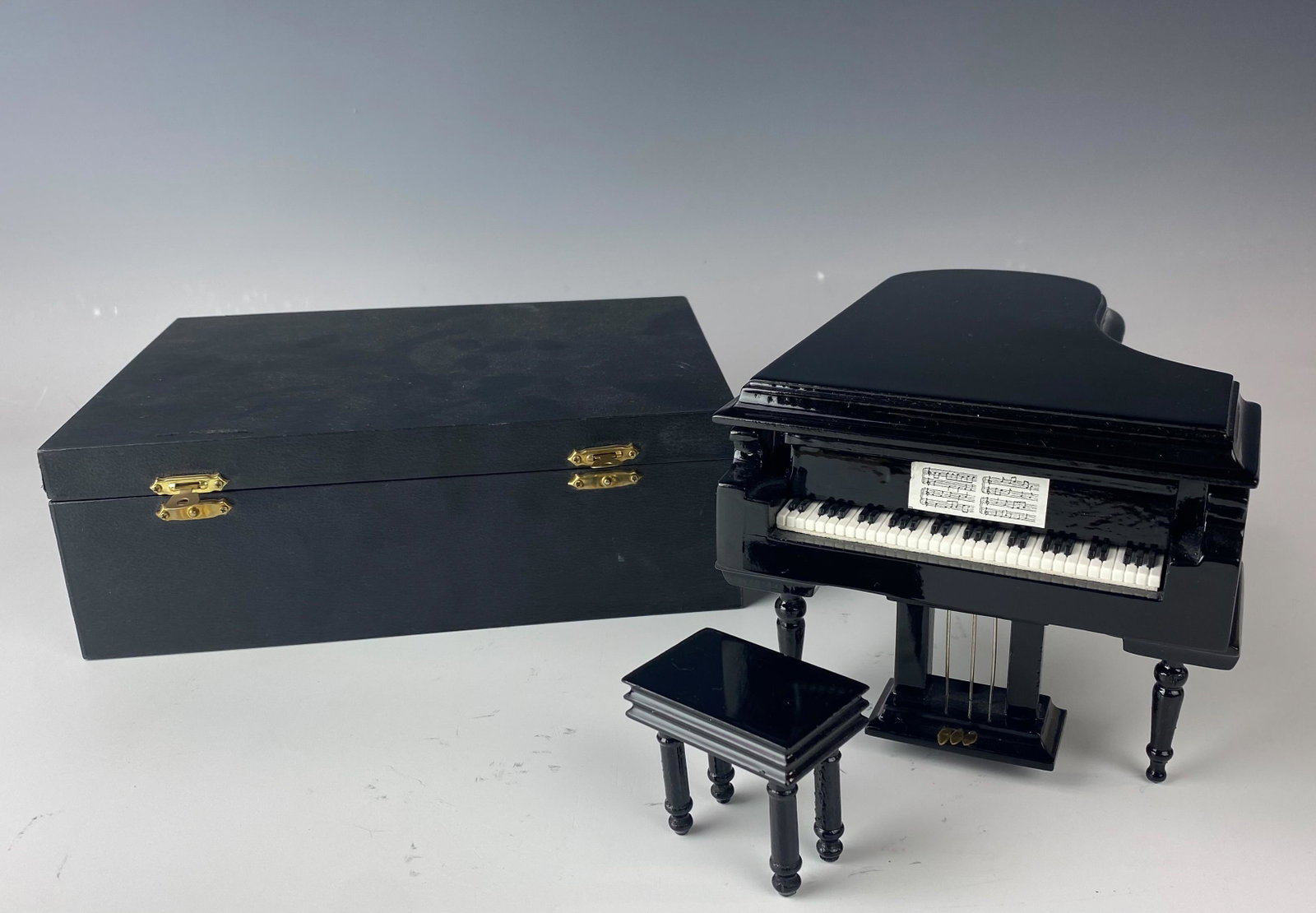 Mini Grand Piano Music Musical Box w Original Case: Mini Miniature Black Colored Grand Piano Music Musical Box with Original Case. We believe the tune to play Waltz of the Flowers [ Nutcracker ]. Securely housed in it's original hard plastic black colo