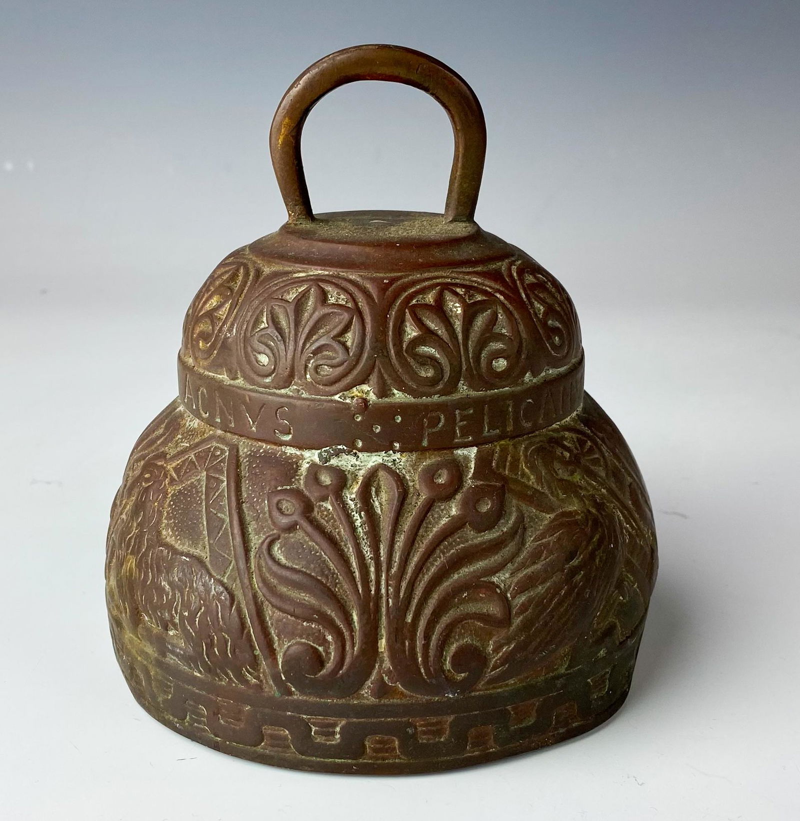 Solid Bronze Lion Lamb Pelican Bird Sanctuary Bell: Painstakingly hand crafted in manner with various raised relief animal and bird motif around, each signifying certain aspects. The words Leo [ The Lion ], Aquilla [ The Eagle ], Agnus [ The Lamb ] and