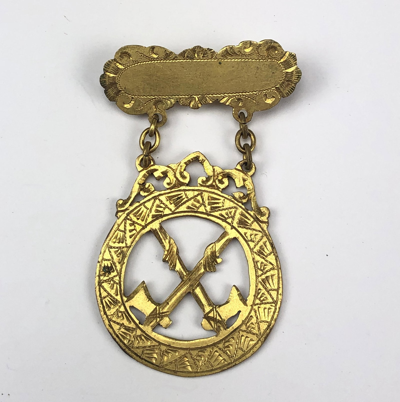 Gold Plated Hand Engraved Military Decorated Pin: Gold Plated Hand Engraved Military Decorated. Designed with a pierced crossed axe design. Simple safety pin closure on the reverse. Unsigned. Good estate fresh condition with moderate wear. Measures a