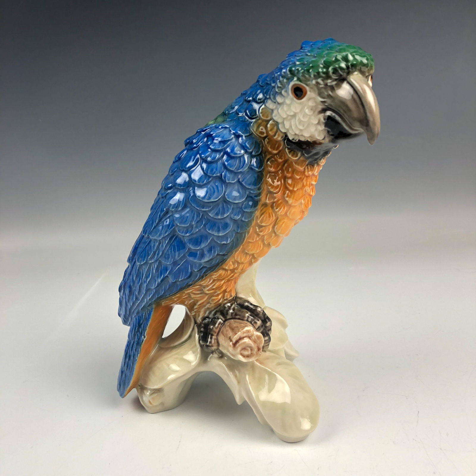 Goebel Blue Green Macaw CV79 Parrot Bird Figurine: Goebel Germany Hand Painted German Ceramic Pottery Exotic Blue Green Macaw Parrot Bird. Model number CV79. Bears the trademark TMK-4 used between 1964-1972 and is known as the Three Line mark. Pretty