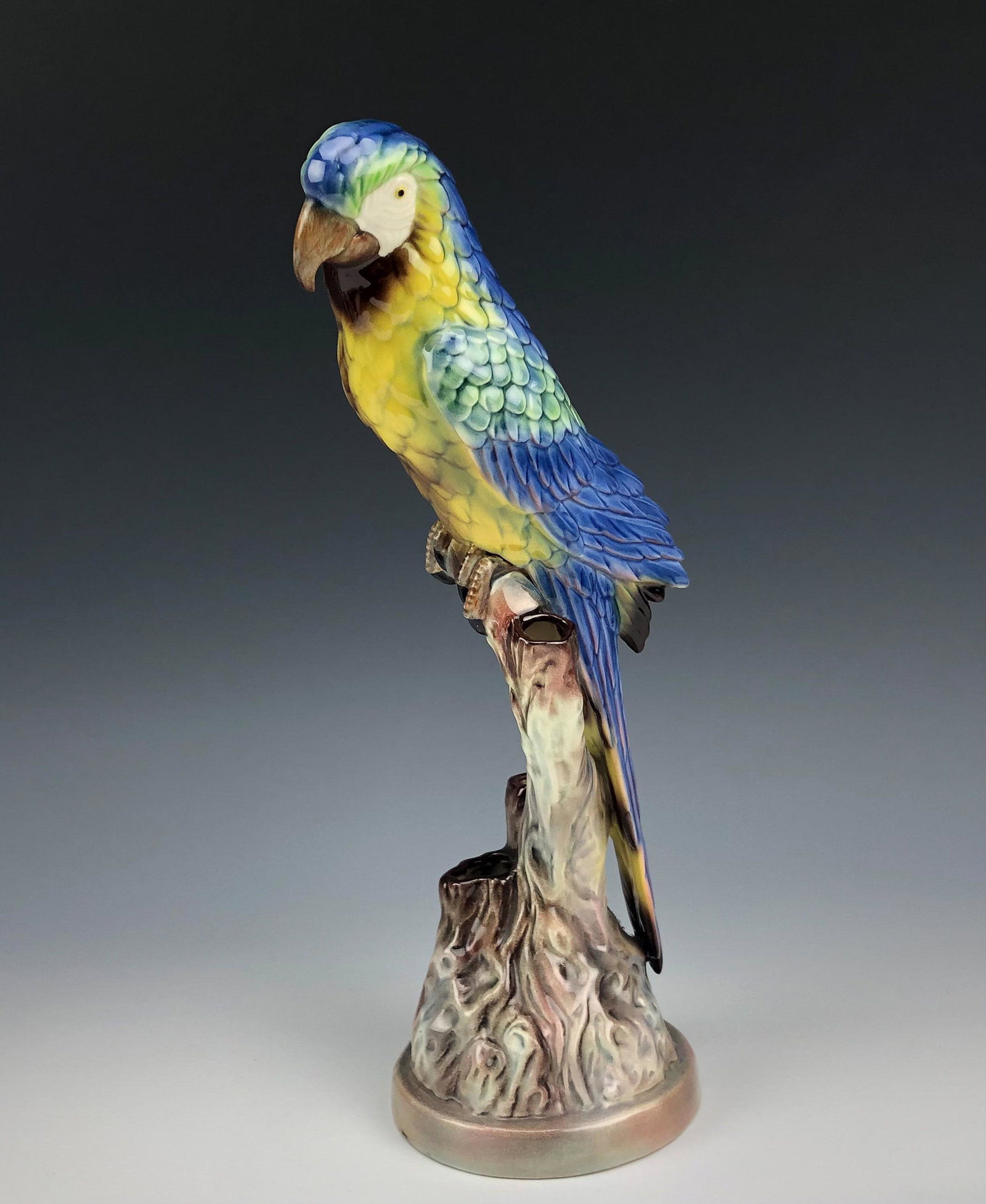 Will George Art Deco Ceramic Macaw Bird Sculpture: Signed Will George Art Deco Hand Painted Ceramic Blue Macaw Parrot Bird on Branch Figurine statue. Will and George Climes founded the Will George pottery in Los Angeles in 1934. Best known for their b