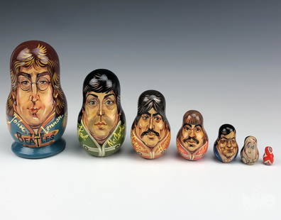 The Beatles Hand Painted Russian Nesting Dolls: The Beatles Russian hand painted nesting dolls. Depicts the faces of the Beatles band, band manager, England flag, and John Lennon memorial piece 1940-1980. Marked in Russian characters. Good overall