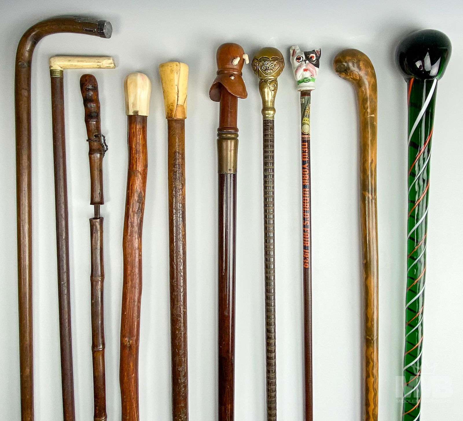 10 pc Walking Cane Collection Murano, Brass & Wood: Lot of 10 - Assorted Vintage Walking Canes. Made of unique materials - art glass, brass, porcelain, bone, sterling silver and exotic woods. Includes canes: from the 1939 World's Fair, wooden antique d