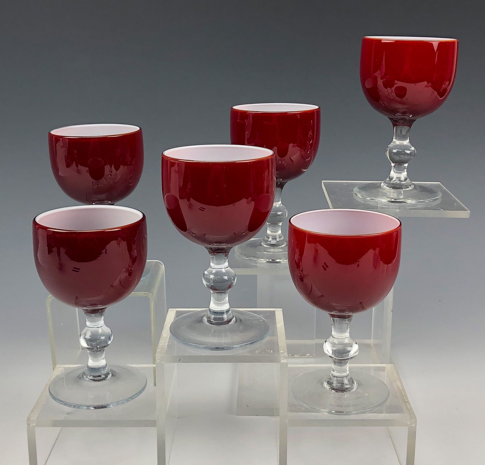 6 Carlo Moretti Mid Century Port Wine Glass Goblet: Established in 1958 in Murano, Venice by brothers Carlo & Giovanni Moretti. Painstakingly mouth blown in manner. Intense blood red exterior masterfully accented by a crisp white cased interior. Clear