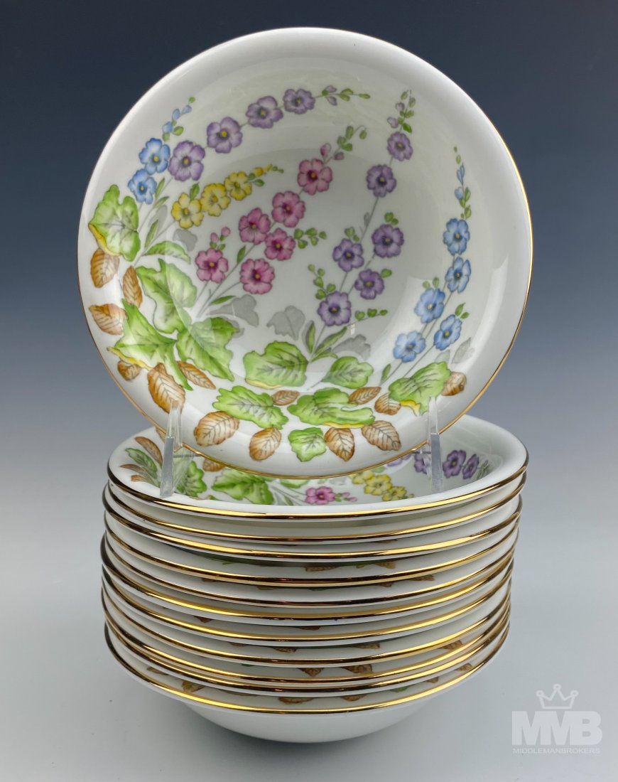 12 Hammersley & Co Bone China Floral Soup Bowls: Set of Neiman-Marcus Hammersley & Co bone china soup bowls. Features floral design on an ivory white plate with a gold trim. Marked on verso. Good overall condition with mild storage wear. Measures ap