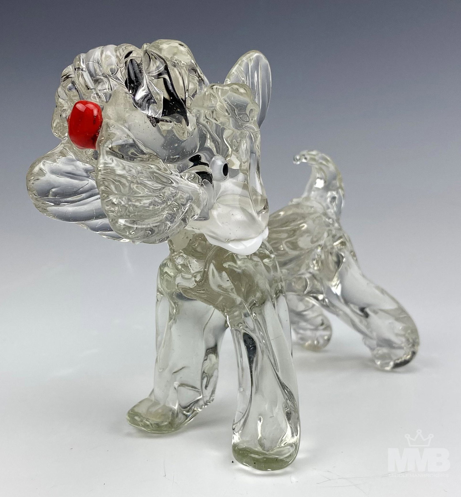 Murano Italian Studio Art Glass Scottish Terrier: Scottish Terrier Murano art glass. Figurine has a red nose, perky ears and white scarf, all made from the finest Italian art glass. Good overall condition with mild storage wear. Measures approximatel