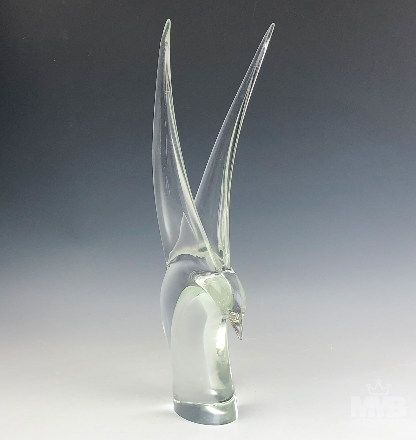 Murano Oggetti Italian Art Glass Bird Sculpture: Oggetti Studios (Murano, Italy). Transitional clear art glass sail bird with raised wings sculpture. Signed on bottom. Good overall condition with mild storage wear. Measures approximately 17 1/2 in.