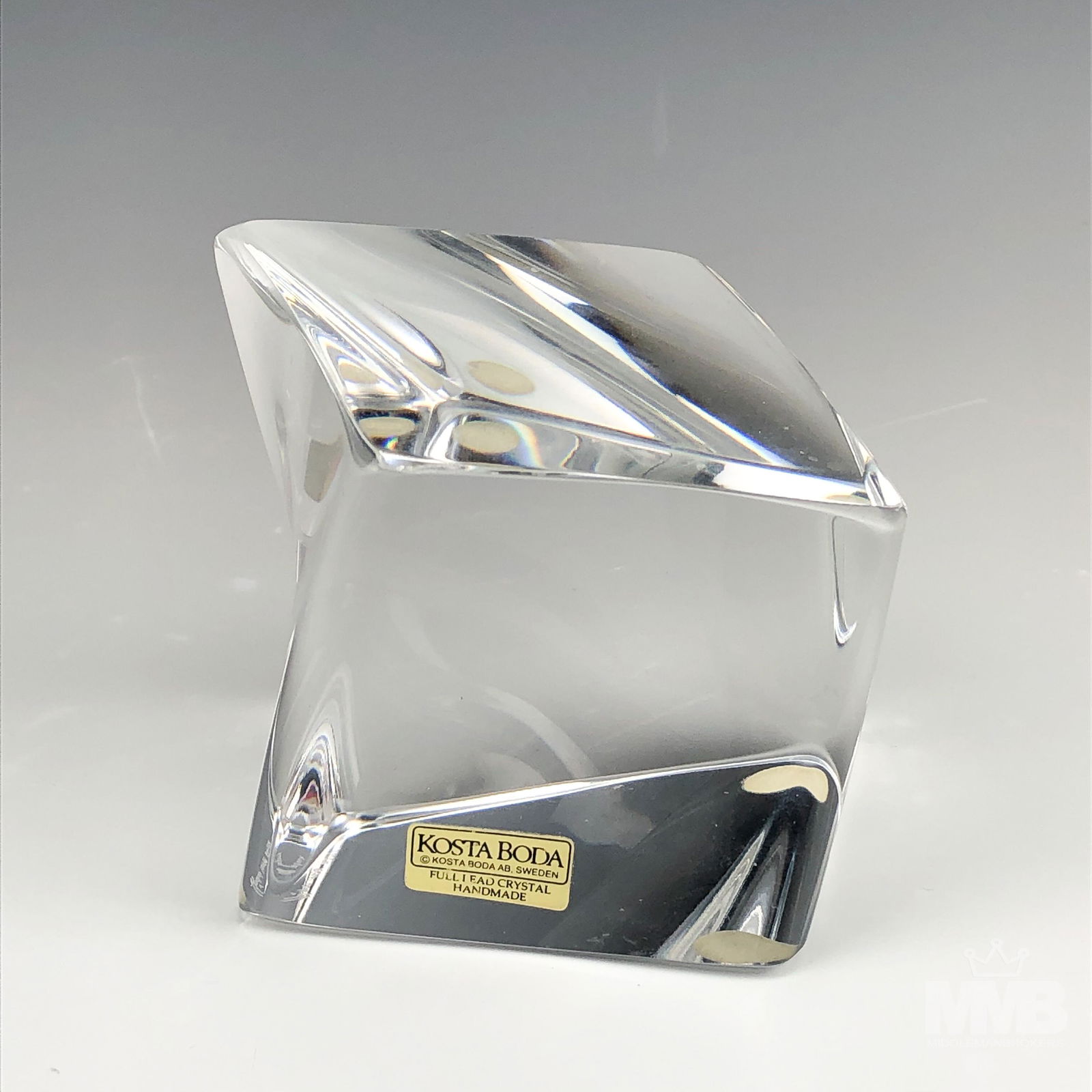 Kosta Boda Goran Warff Twist Cube Glass Sculpture: Goran Waraff for Kosta Boda. Twisted cube art glass sculpture. Signed on bottom. Good overall condition with mild storage wear. Measures approximately 3 in. x 3 1/2 in. x 3 1/2 in. MMB in house USA co