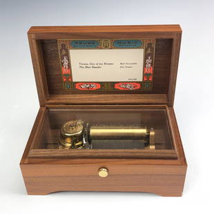 Reuge Sainte Croix Music Switzerland Music Box VTG: Reuge music box. Made in Switzerland, wooden case hinged music box. CH 250. TESTED- working. Measures approximately 3 in. x 6 1/2 in. x 4 in. MMB in house USA continental shipping $35 plus insurance.