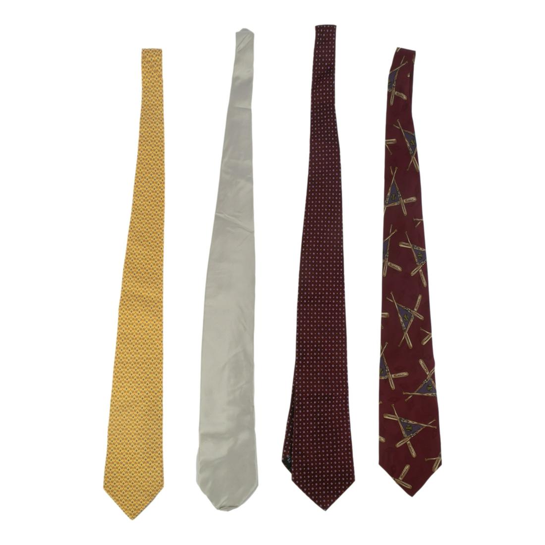 Brioni Ferragamo Valentino XMI Men's Designer Ties: Collection of four designer men's dress ties. Includes (1) Salvatore Ferragamo gold elephant pattern tie. (1) Valentino burgundy pattern tie. (1) Brioni silver silk tie. (1) XMI burgundy with base bal