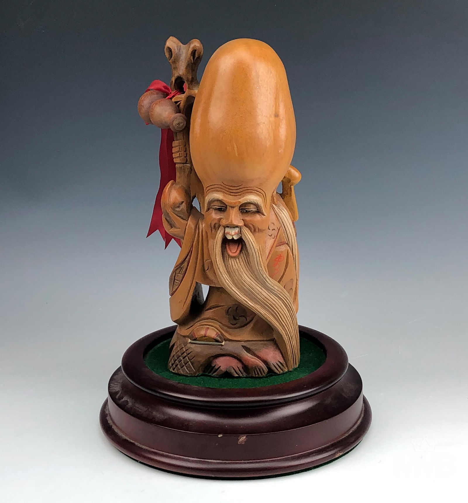 Chinese 10" Carved Wood Immortal Scholar Sculpture: Hand carved wood featuring an Old Wise man. Very good attention to detail. Comes on circlar wood base. Good overall condition with mild storage wear. Measures approximately 10 1/2 in. x 4 1/2 in. x 3