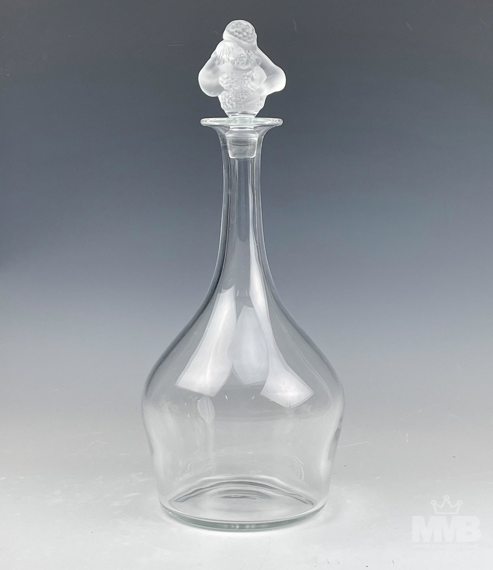 Lalique French Crystal Bar Barware Whisky Decanter: Features a clear crystal art glass bar barware alcohol liquor decanter by Lalique, France. Body with open mouth over elongated neck over bulbous tapered body. Frosted stopper features nude women and g