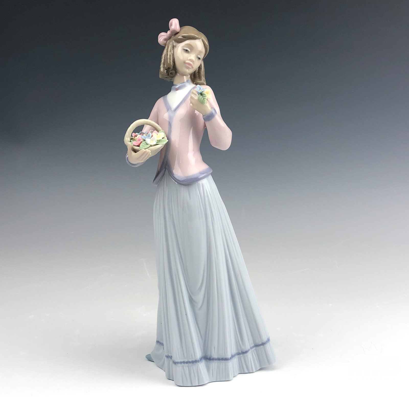 Lladro Innocence in Bloom #7644 Porcelain Figurine: Lladro Spain "Innocence in Bloom" Model Number 7644 Hand Painted Glazed Signed Porcelain Figurine. Designed by sculptor Jose Puche in 1996. Retired in 1996. Features a young girl, holding a flower bas