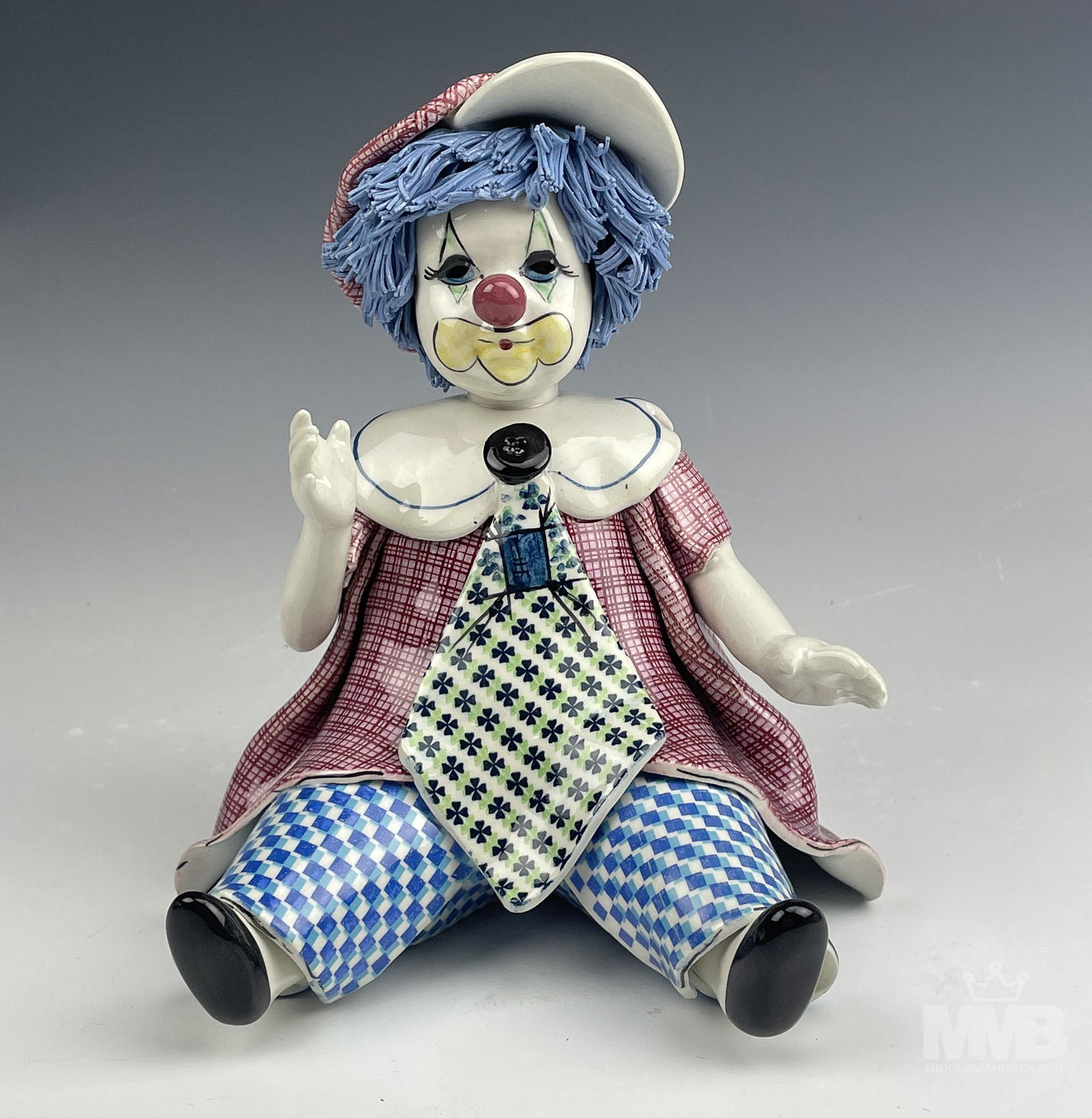Zampiva Italy Pottery Ceramic Clown Doll Figurine: Lino Zampiva Italian Mid Century Modern Studio Hand Crafted and Painted Ceramic Pottery Figurine. Owner of the Pastelceramica ~ established 1976. Features a seated clown doll with blue spaghetti hair