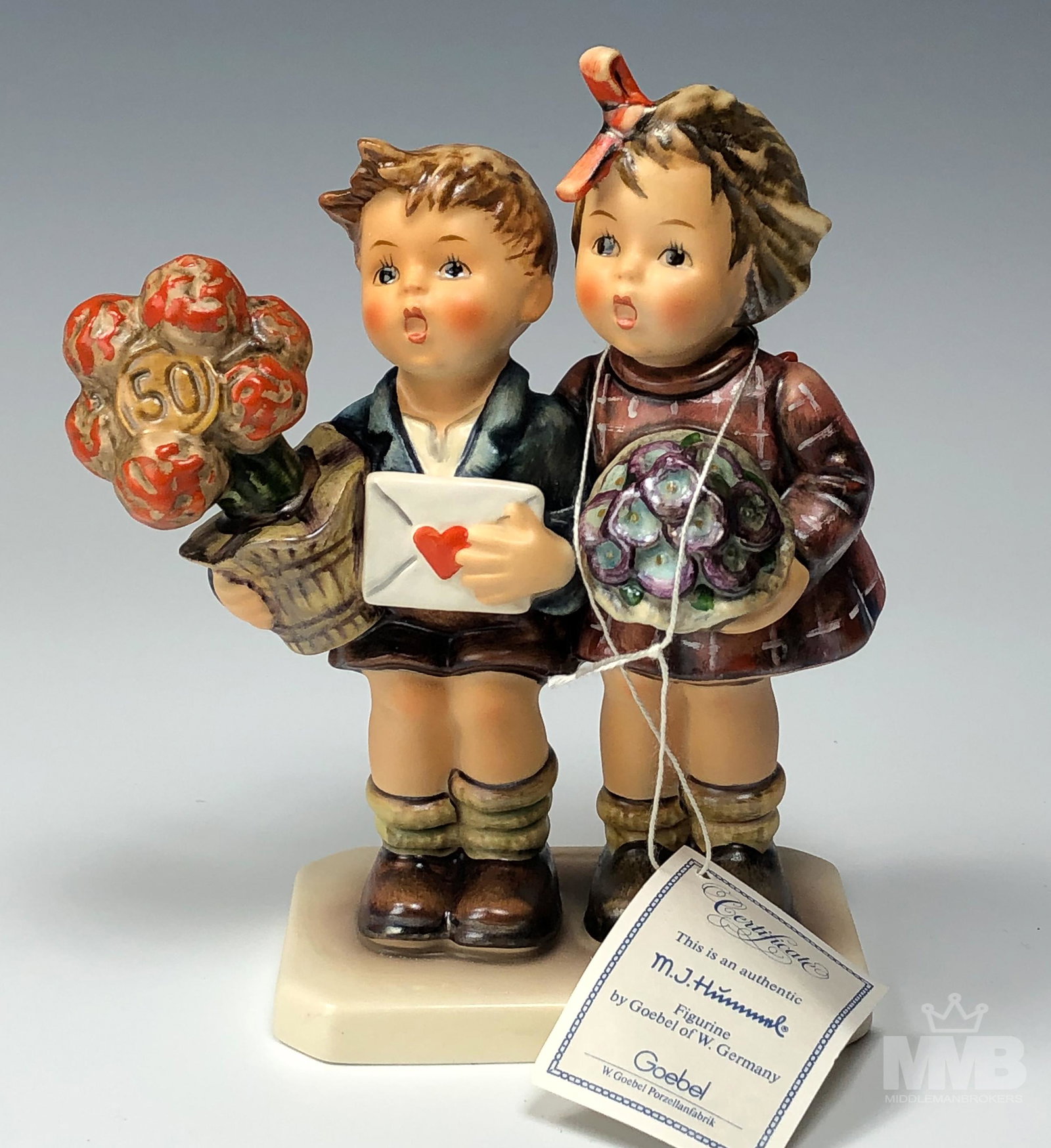 Hummel The Love Lives On # 416 Figurine Box & COA: Limited Edition Hummel figurine celebrating 50 years of their creation. Released in 1985 and retired in the same year. Securely housed in it's original box and carries it' COA. Good condition. No craz