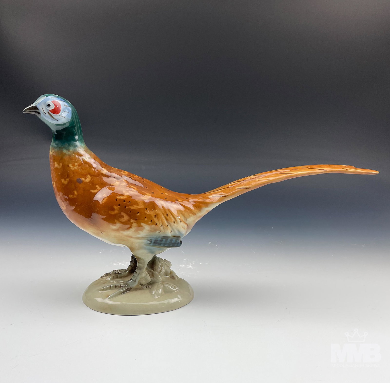 Royal Dux Bohemian Czech Ceramic Pheasant Figurine: Warm nature inspired subject matter featuring this large chicken like bird with it's long pointed tail, fairly long legs, small head and plump body. Have quickly become one of North America's most pop