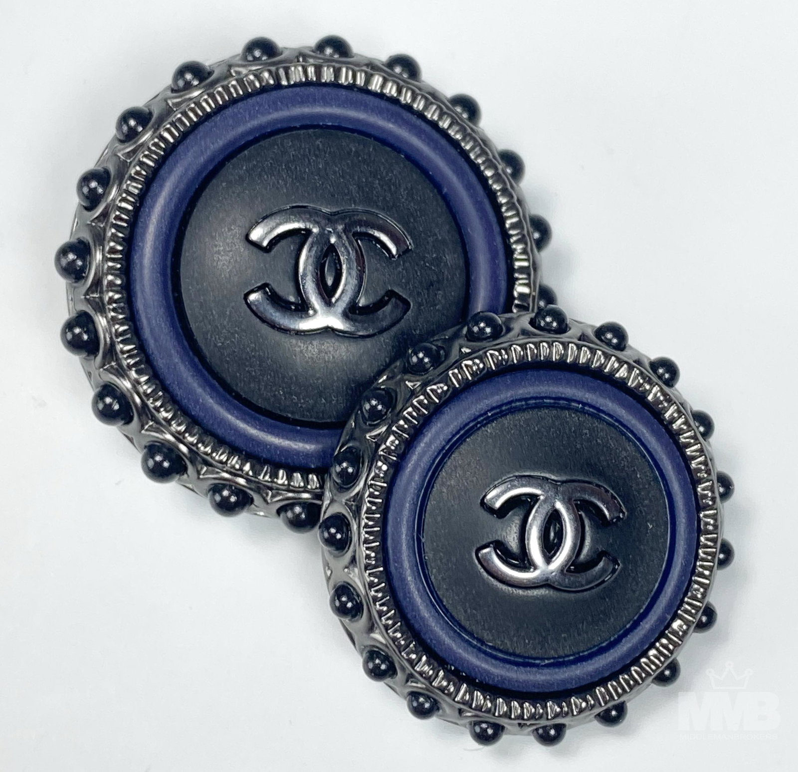 Chanel France Lot 2 Luxury Designer Jacket Buttons: 2 Chanel Paris France Luxury designer dresser, coat, jacket replacement buttons. Interlocking CC logo on each against a black ground. Good condition. No chips, cracks or repairs. Measures 7/8 in. - 1i