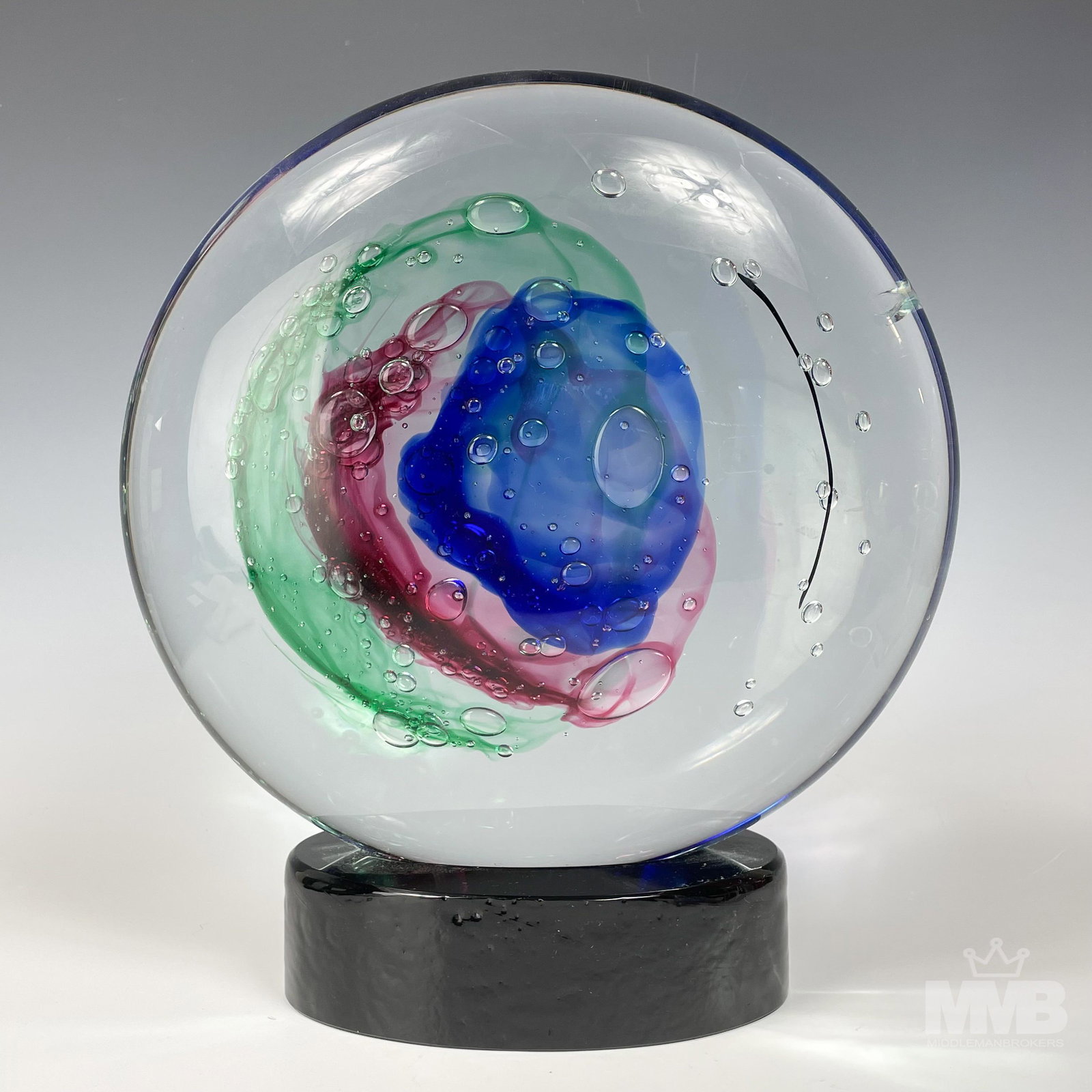 Luigi Onesto Murano Italian Cased Glass Sculpture: Luigi Onesto (Italian, b.1935). Known to be one of the greatest Murano glassmakers in Italy. Design features a disc shaped form with an internal cased multicolored mass with varying sized controlled b
