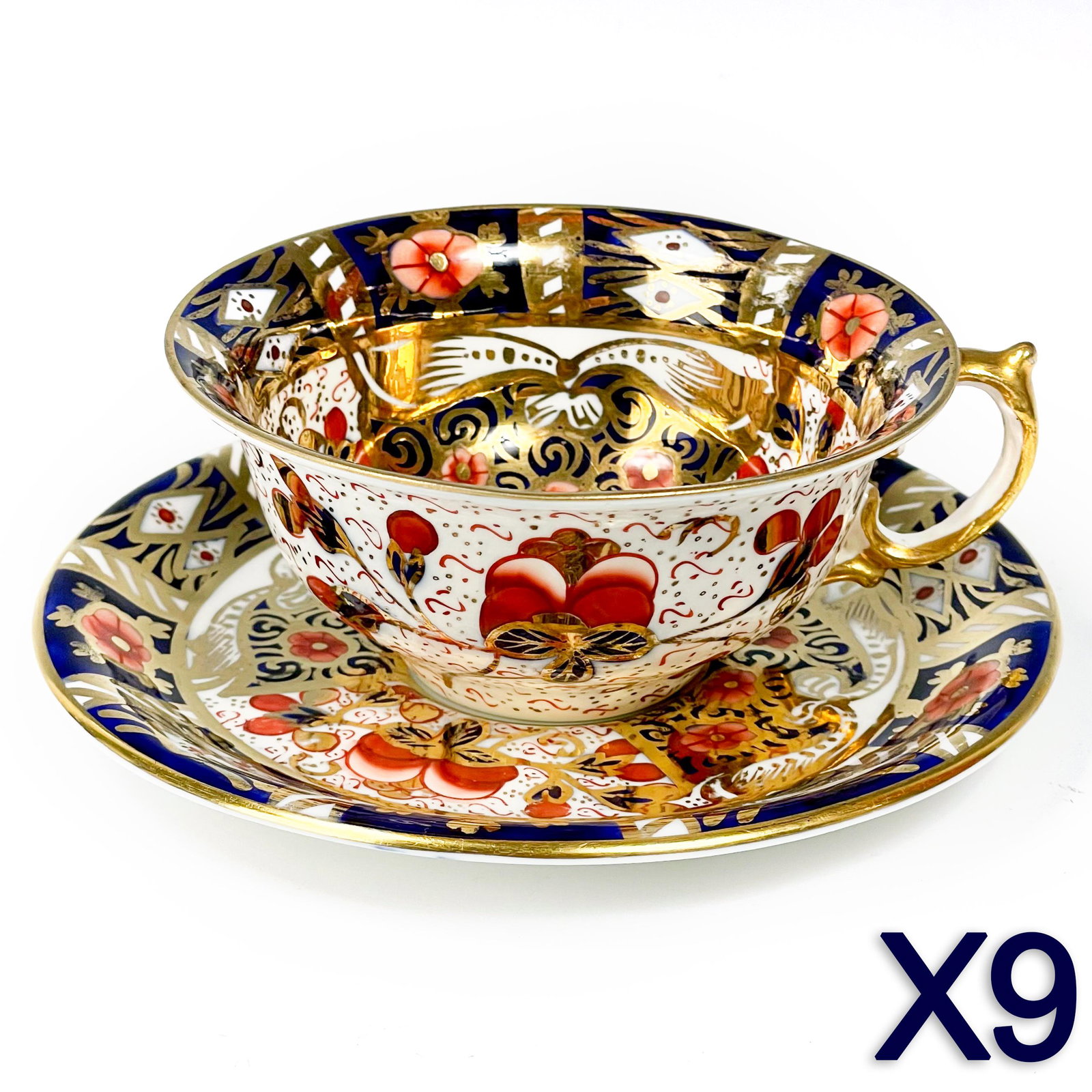 9 Royal Crown Derby Style Imari Tea Cups & Saucers: Offered for auction are 9 sets of bone china cups and saucers. All modeled in the style of Royal Crown Derby with a painted palette of rich cobalt blues, rusts and graced with gold embellishments agai