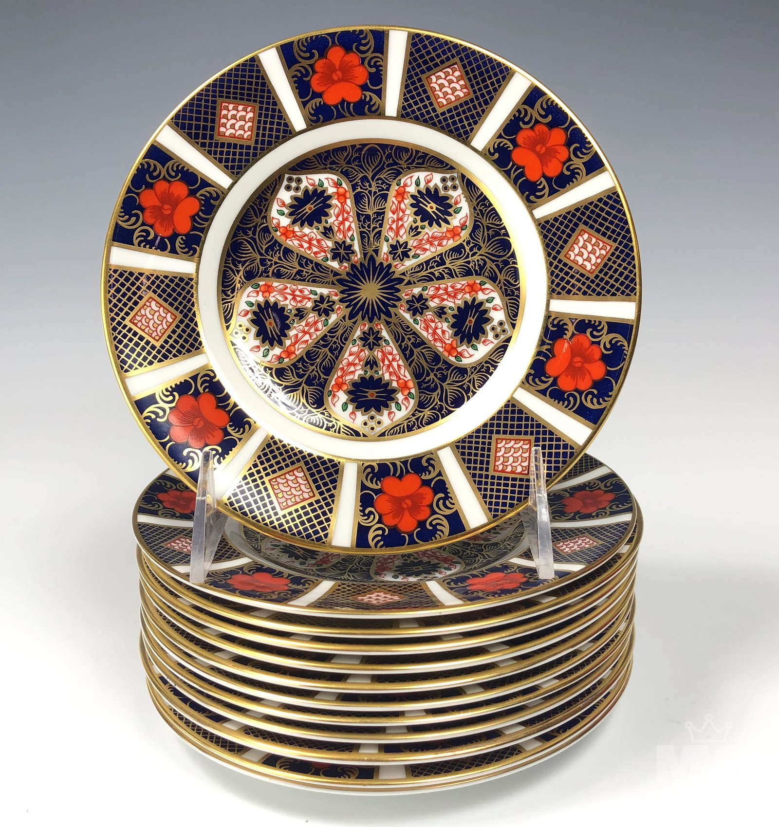 12 Royal Crown Derby Old Imari Bread Butter Plates: Offered up for auction is a set of 12 English bone china bread and butter plates. Modeled by Royal Crown Derby in their "Old Imari" pattern that was first introduced in 1901. Articles beautifully deco