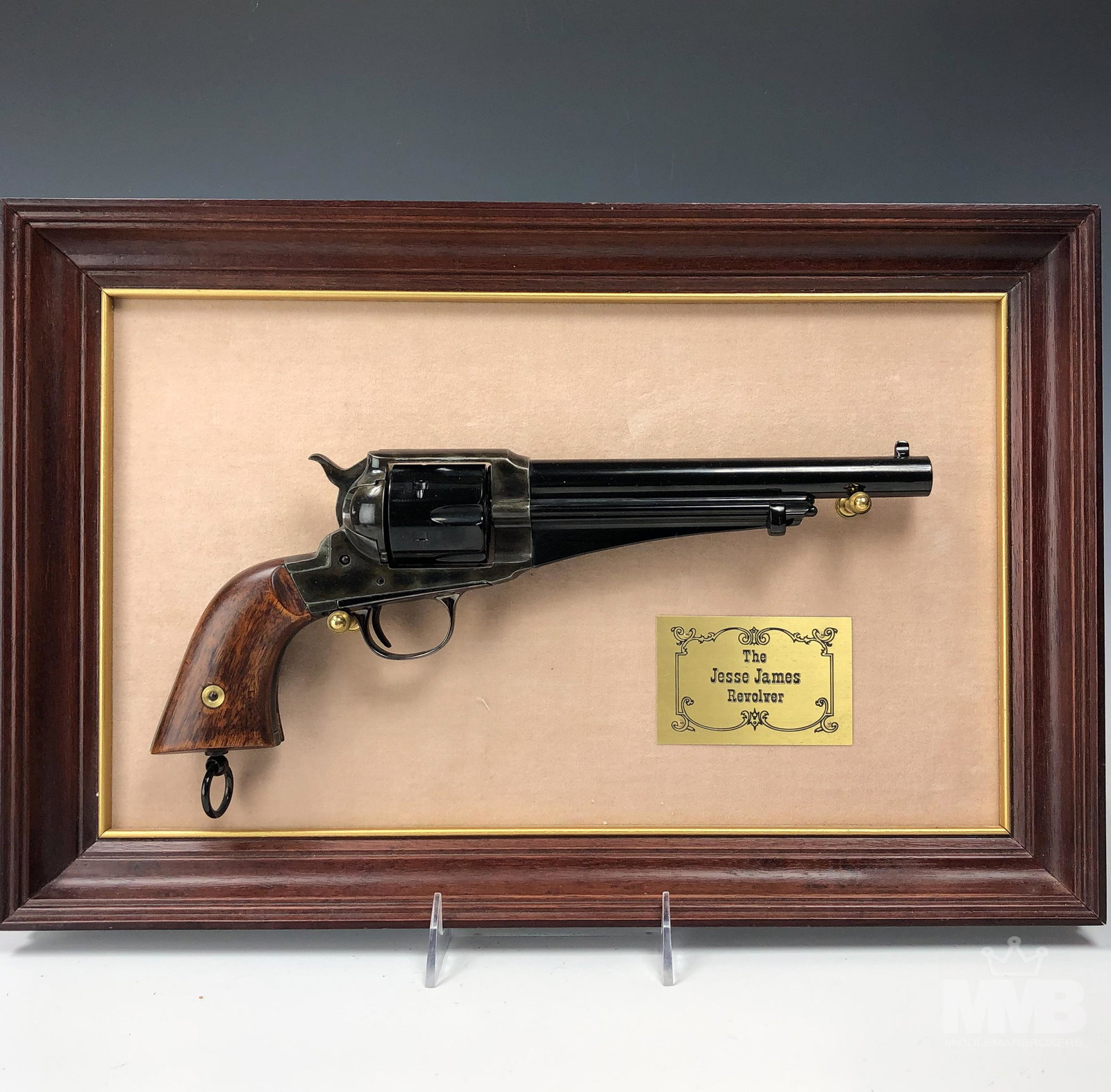 Jesse James 45 Caliber Remington Revolver Replica: This NON FIRING firearm issued by The Franklin Mint is a replica of a Jesse James Commemorative 45 caliber Remington revolver ~ 1875. Features hardened steel frame, black walnut grips, blued steel bar