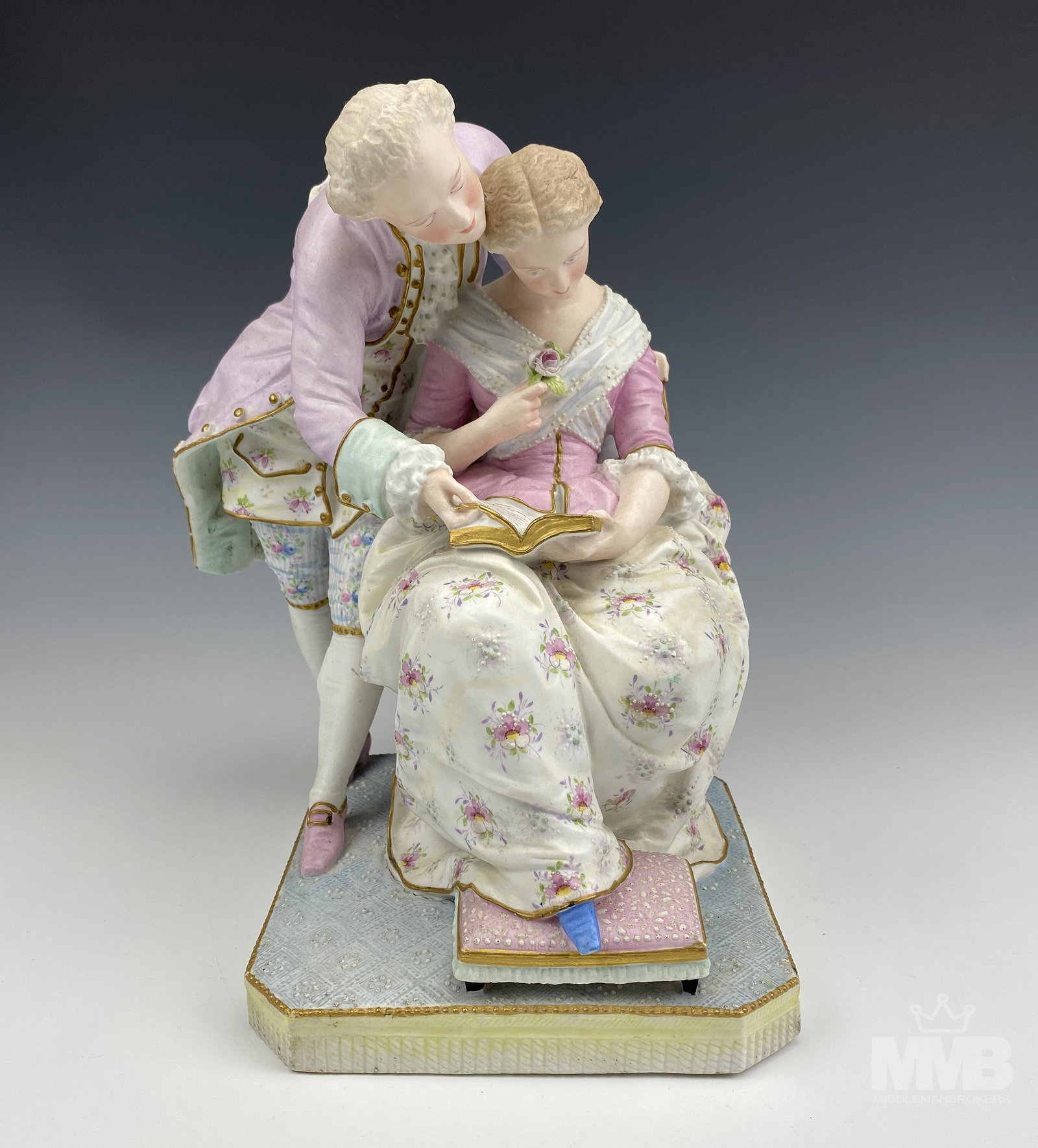Antique Vion et Baury French Porcelain Figurine: Features a Victorian era romantic courting couple. Well detailed with pastel painted coloration. Warm matte textured finish. Good condition. No chips, cracks or repairs. Measures 11 in. x 8 in. Signed