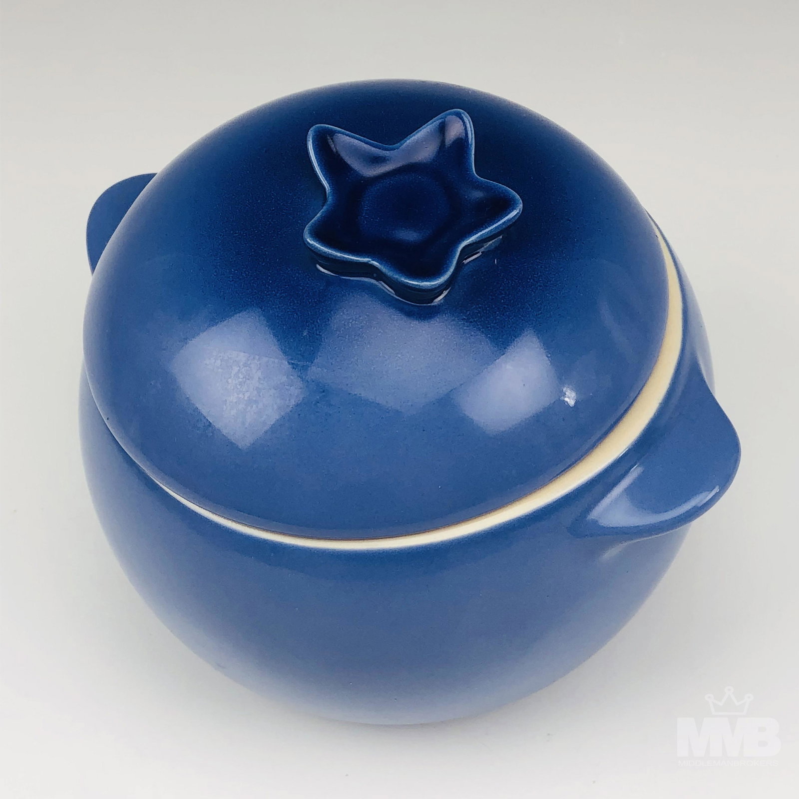 Le Creuset Petite Blueberry Mini Crock Casserole: Le Creuset Stoneware Petite Blueberry Lidded Casserole. Made of durable high fired stoneware with a blue enamel glaze. Features tab handles and a secure lid with a sculptural floral inspired motif. Th