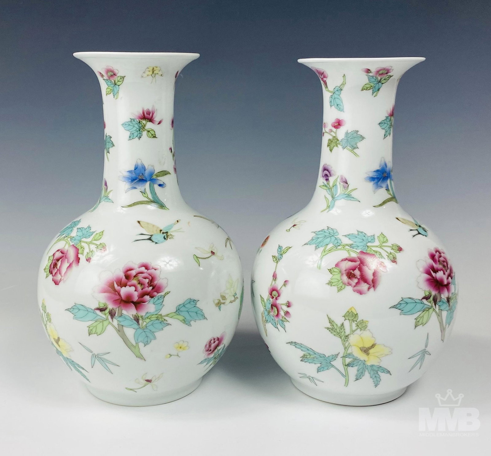Pair Chinese Painted Porcelain Floral Insect Vases: This auction is for a pair of Chinese hand painted porcelain shelf mantle display vases. Of simple shape with open mouth over low shouldered bulbous tapered bodies with circular bases. Each graced wit
