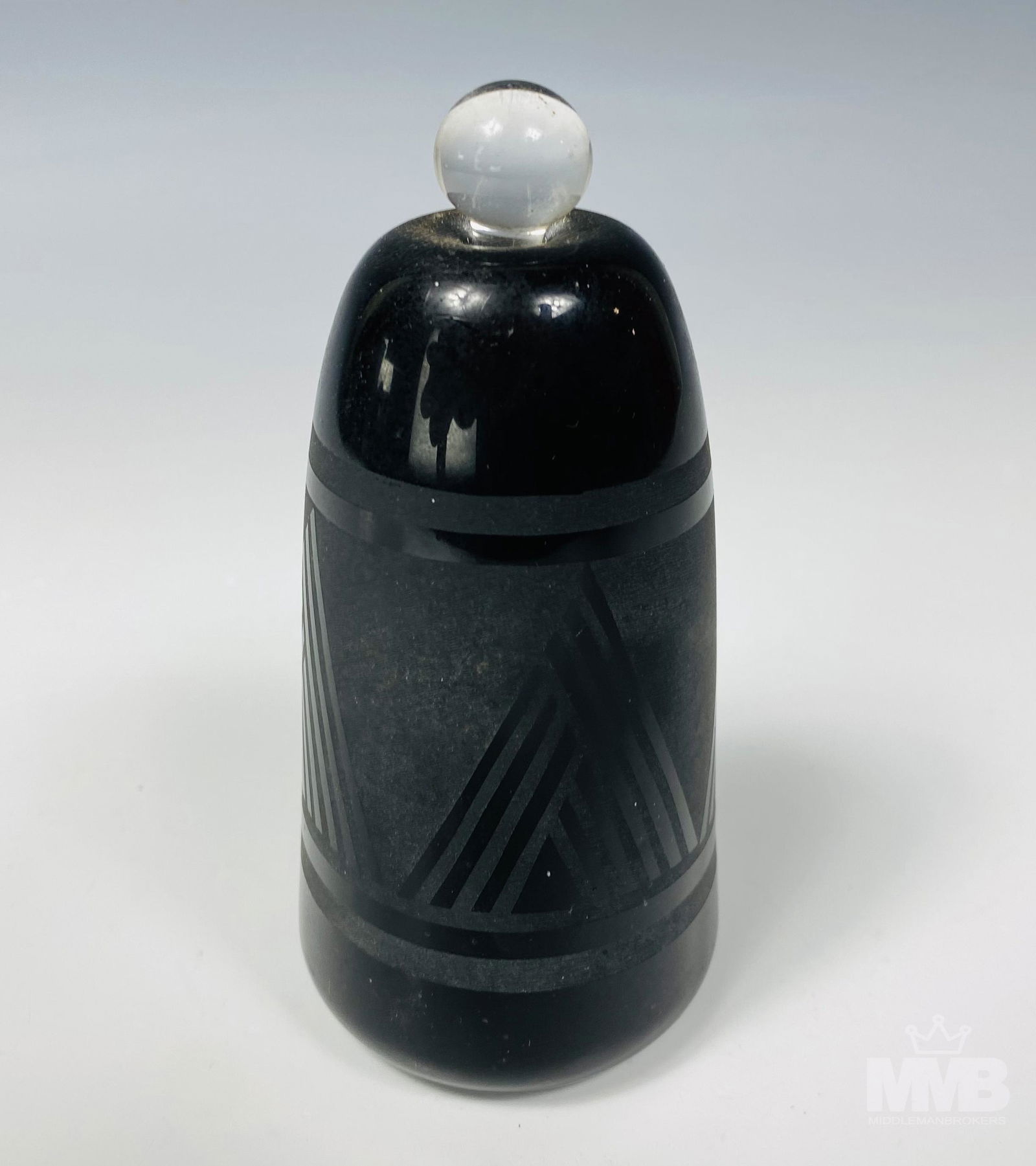 Janet Kelman 20c Black Glass Etched Perfume Bottle: Janet Kelman (20th century). Black art glass perfume bottle with etched triangle designs. Artist signature and dated 1981 on bottom. Good overall condition with mild storage wear. Measures approximate