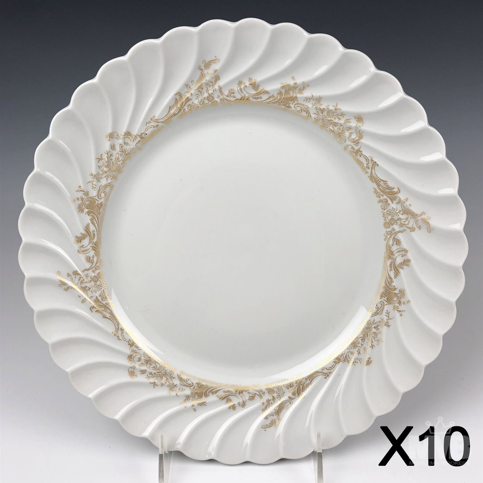 10 Haviland Limoges Ladore Porcelain Dinner Plates: Each graced with a dull gold floral and scroll pattern against a crisp white ground. The scalloped borders with a slant swirl segmented design. Production years 1962 - 1988. Glazed finish. Good estate