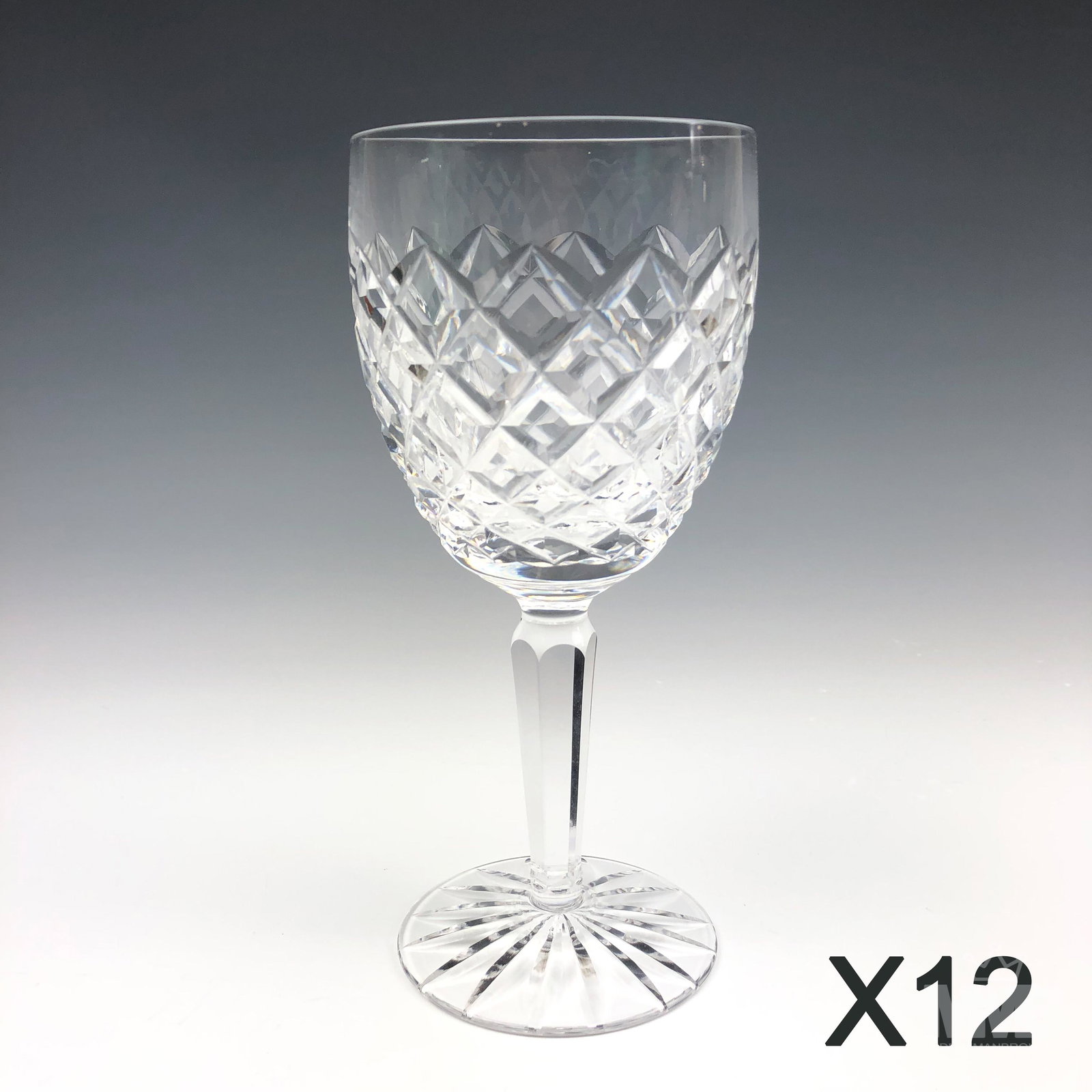12 Waterford Crystal Comeragh Water Glass Goblets: Design features a cut diamond quilted pattern around the body over a circular base with star burst design to the underside. Production years : 1974 - 2017. No box. Good estate fresh condition. No chip